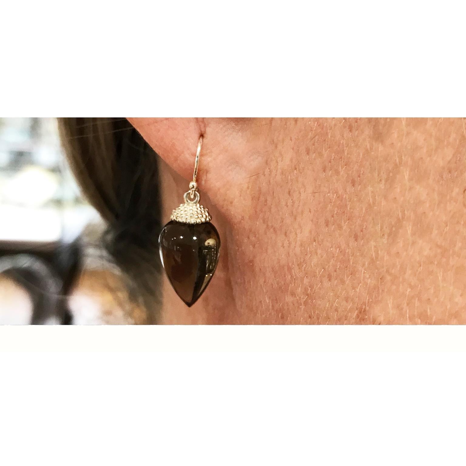 Faye Kim Sterling Silver Smoky Quartz Acorn Earring

Beauty in simplicity. These acorn style drop earrings in smooth smoky quartz are light and translucent  and so easy to wear.  These earrings are your 