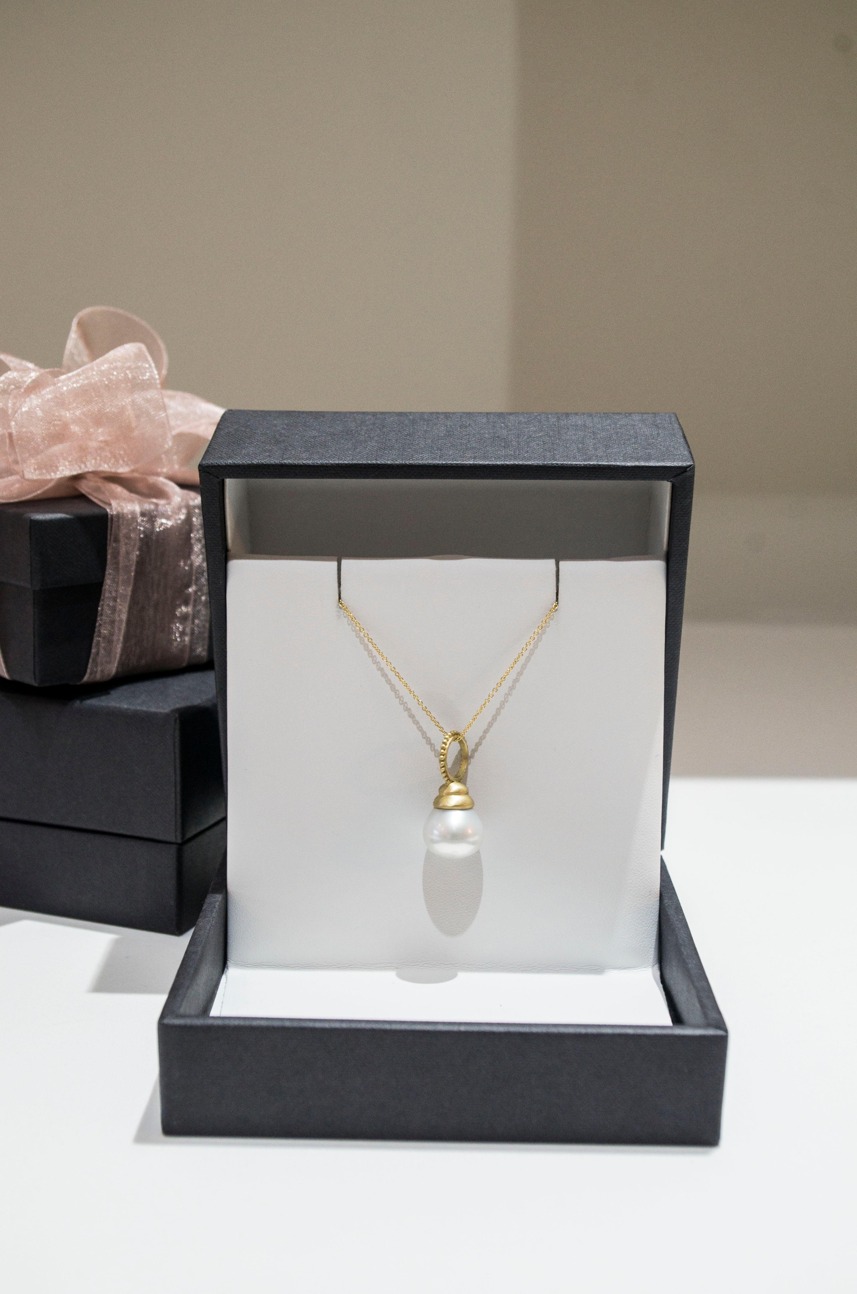 White South Sea Cultured Pearl Drop Pendant finished with an 18k Gold Cap. In Faye Kim's signature 18k Green* gold and granulation bail, the traditional pearl drop is transformed to a modern and fresh design for today's contemporary style. Can be