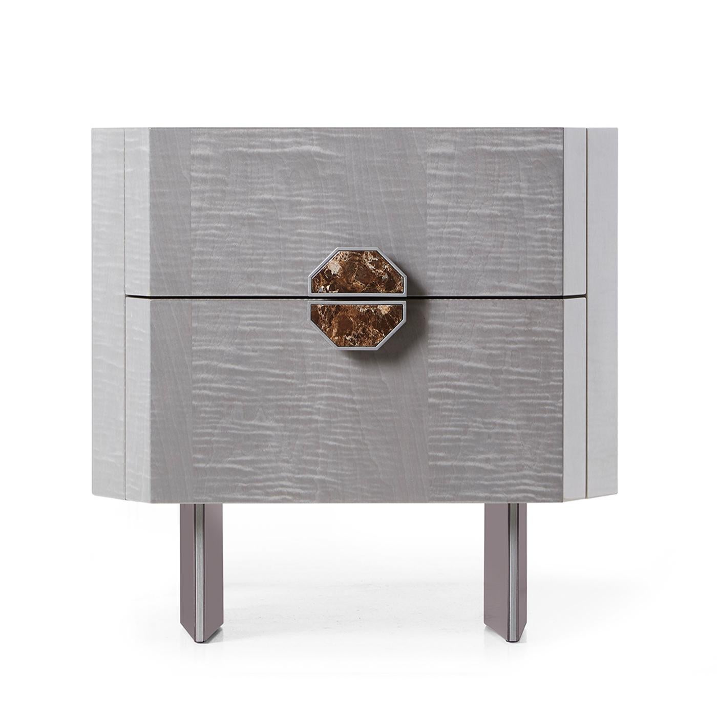 This elegant chest of 2 drawers has a wooden top, metal trims, and lacquered legs. The opening is facilitated by a precious Emperador Dark marble handle. Characterized by Lupo glossy finish, details are made of Nickel metal.