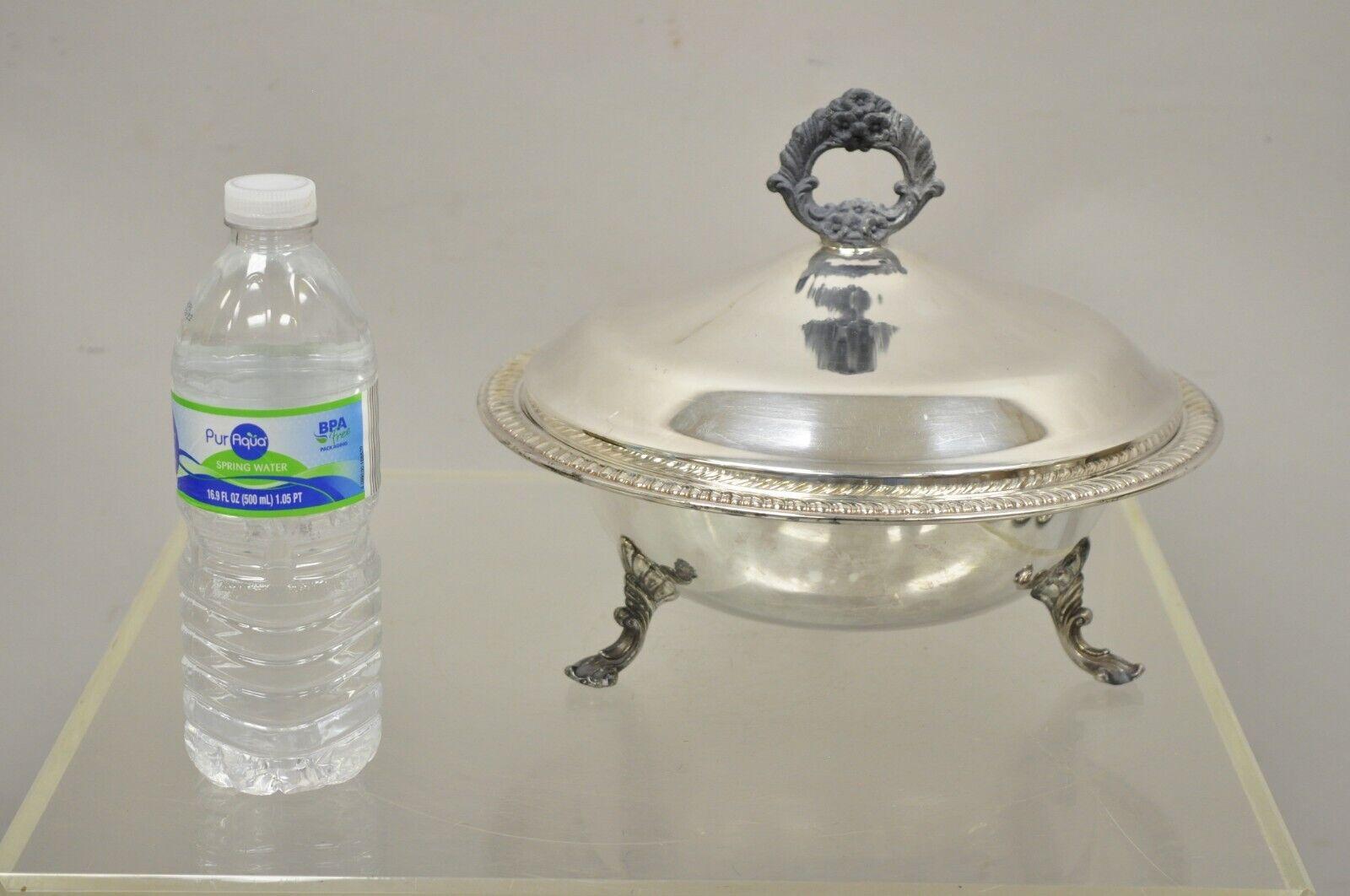 FB Rogers Silver Co 1158 silver plated footed covered dish serving bowl. Item features raised on feet, lidded dish with handle, original stamp, very nice vintage item. Circa mid to late 20th century. Measurements: 8