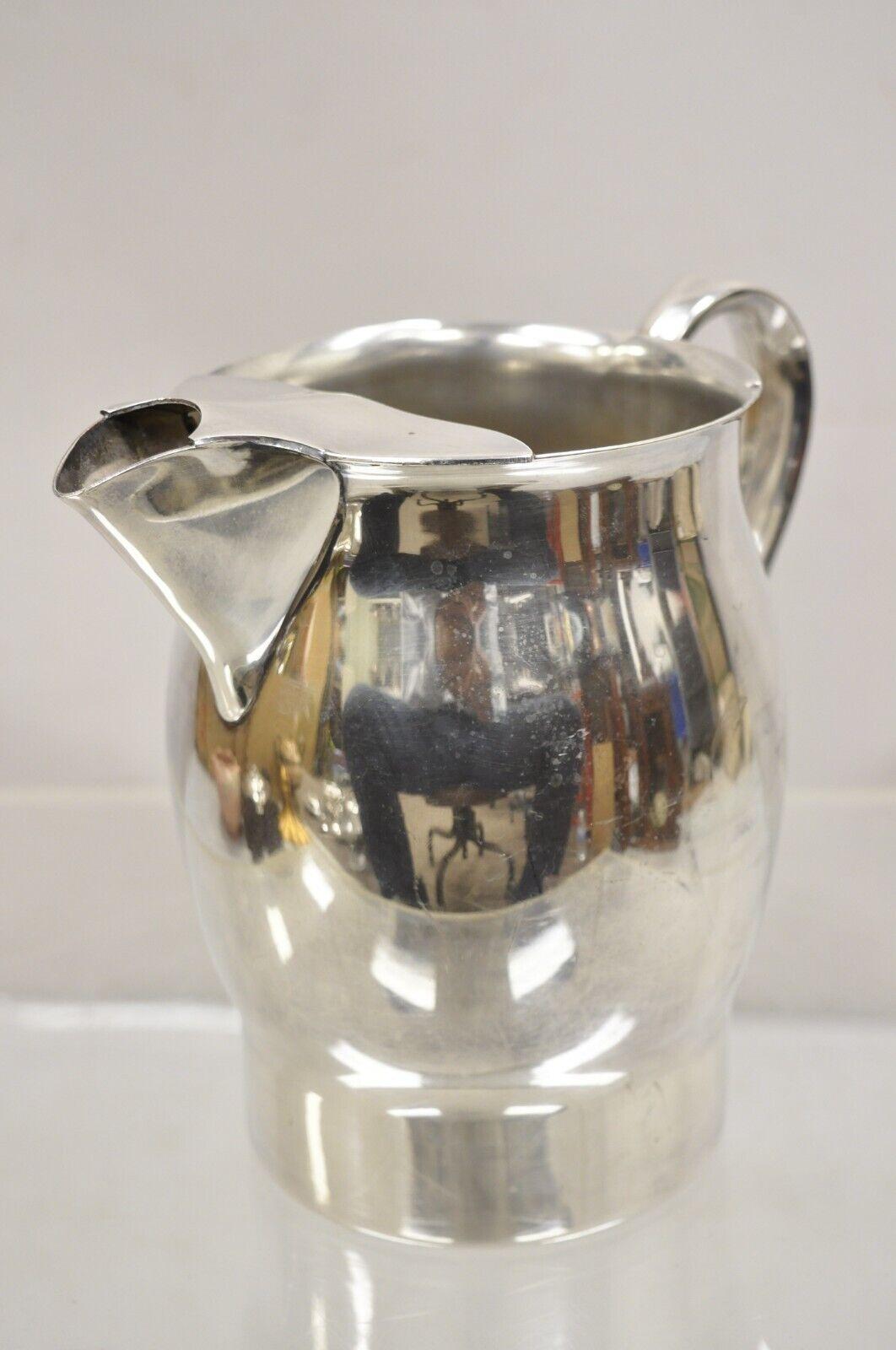FB Rogers Silver Co Silver on Copper 7504 Water Pitcher. Circa 1970s. Measurements:  7.5