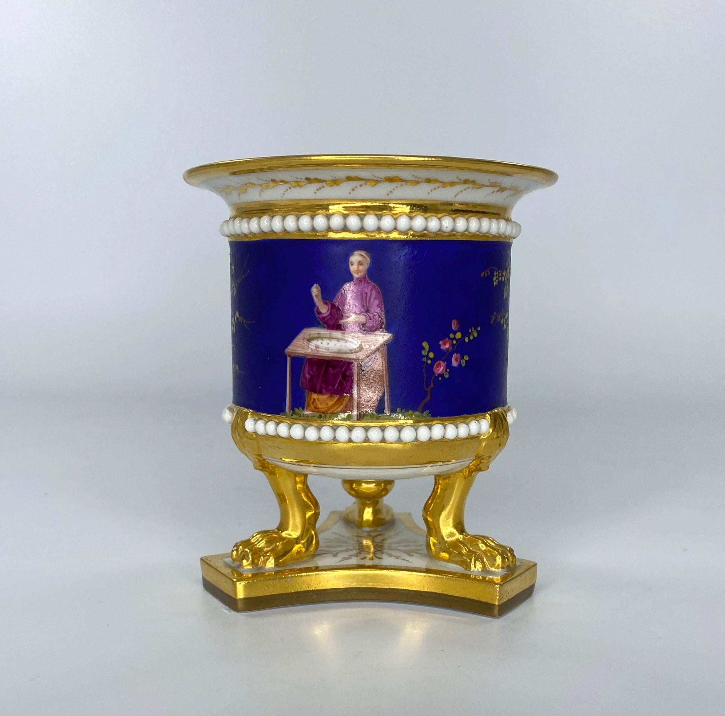 SOLD
Fine Flight Barr & Barr Worcester porcelain urn, c. 1815. The drum shaped urn, unusually painted with a Chinoiserie scene of people in Chinese costume seated at tables, working with textiles, between flowering plants, on a Matt blue