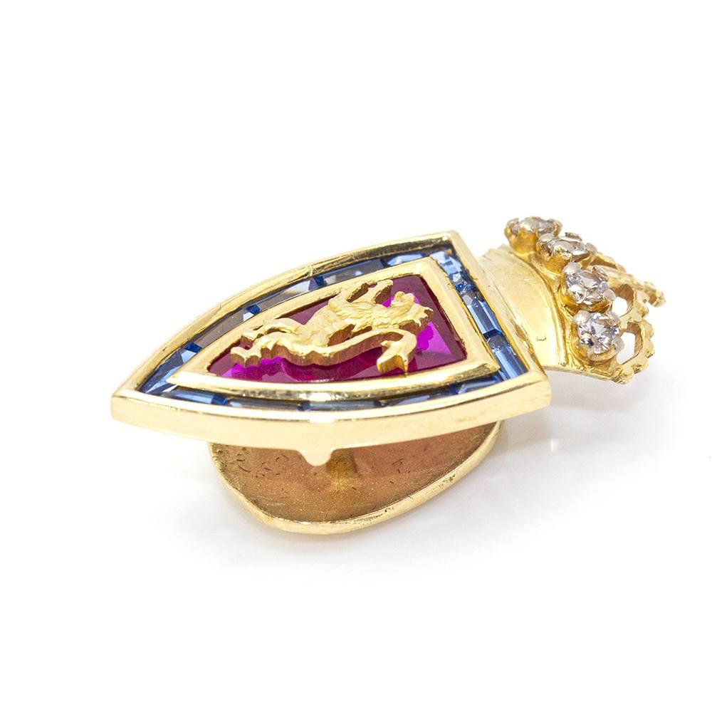 Futbol Club Zaragoza Shield Lapel Pin in Gold, Diamonds, Ruby and Sapphire : 4x Brilliant Cut Diamonds with total weight approx. 0,08ct, 13x Baguette Cut Sapphires and 1x Ruby : 18kt Yellow Gold : 4,50 grams : This shield is in excellent condition :