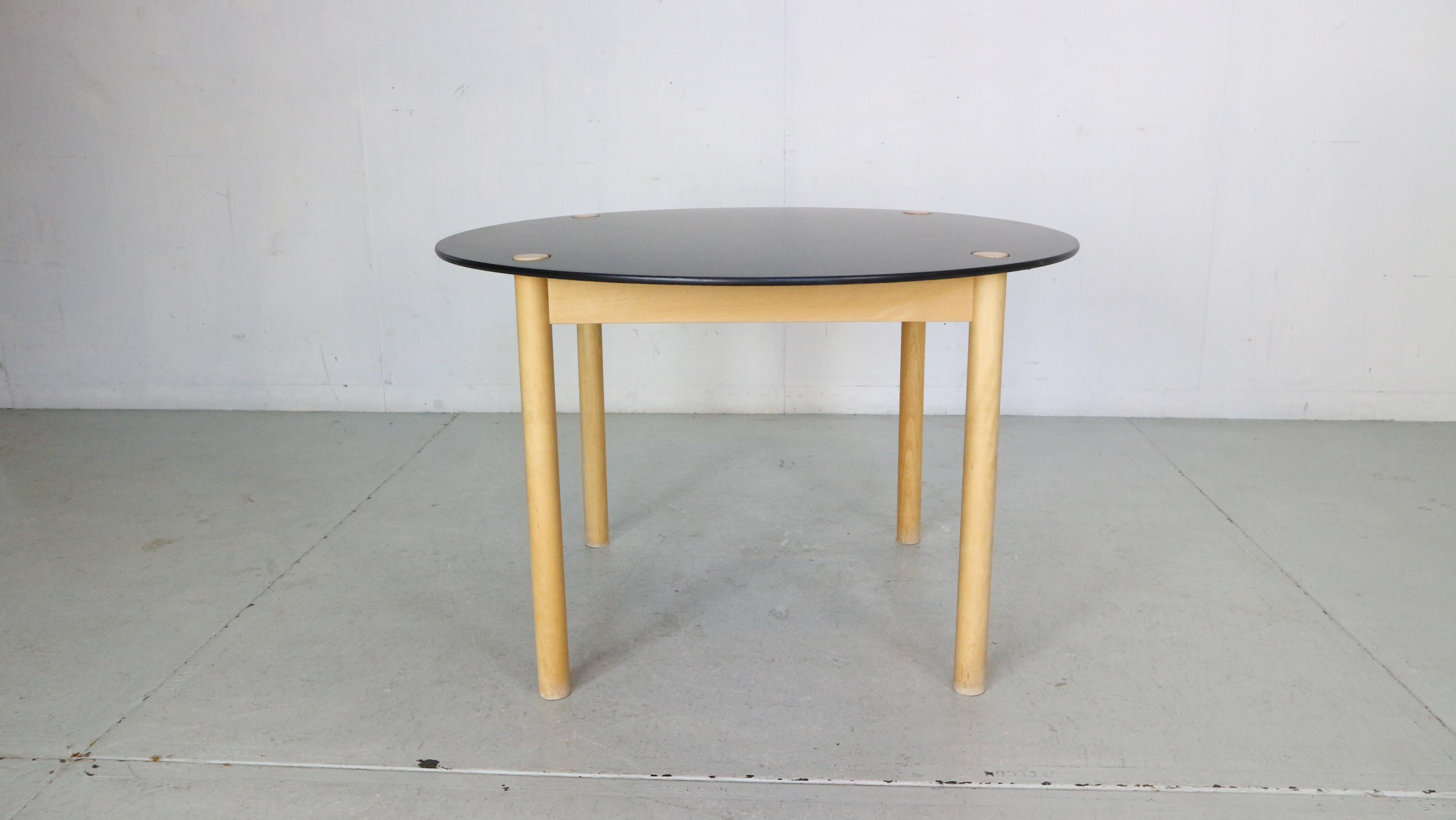 Mid-Century Modern period very unique flip-top round dinning table designed by famous Danish furniture designer Børge Mogensen and manufactured by FDB Møbler in 1950's circa.

The table is made of solid oak wood and the flip-top is finished with