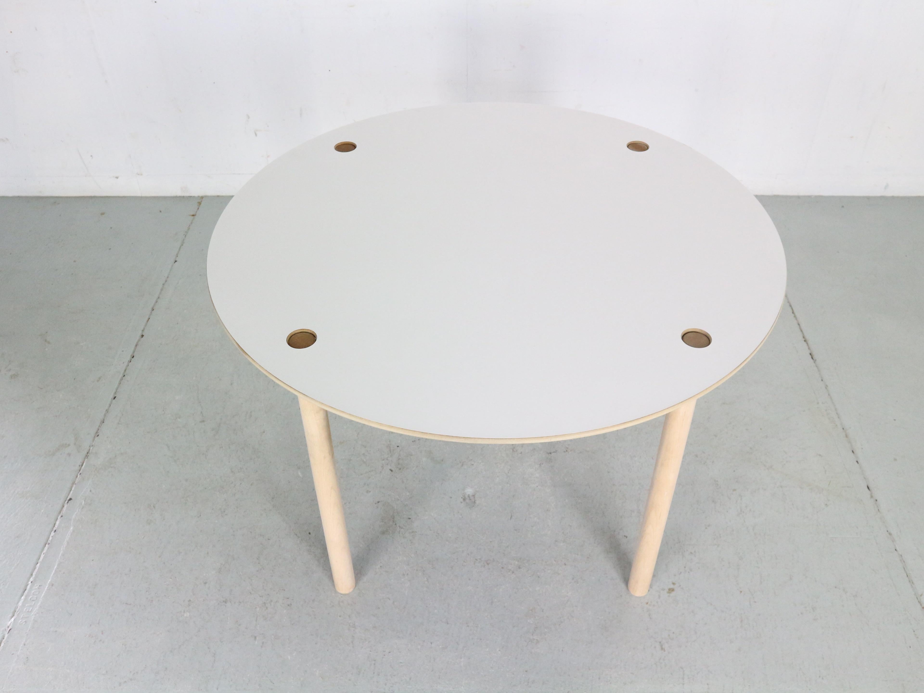 Mid-Century Modern period very unique flip-top round dinning table designed by famous Danish furniture designer Børge Mogensen and manufactured by FDB Møbler in 1950's circa.

The table is made of solid oak wood and the flip-top is finished with
