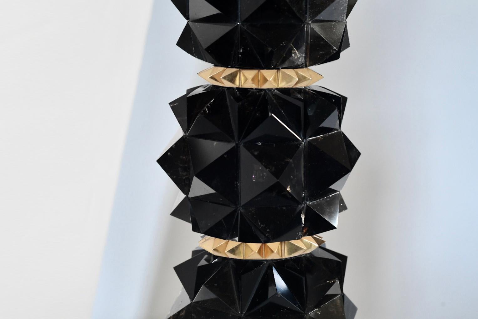 Pair of fine carved faceted dark rock crystal lamps with polished brass decoration. Created by Phoenix Gallery, NYC.
To the top of rock crystal: 16.5
