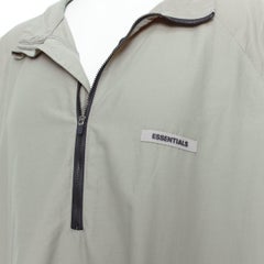 FEAR OF GOD ESSENTIALS khakifarbener Baumwoll-Nylon-Pullover mit halbem Reißverschluss und Logo L