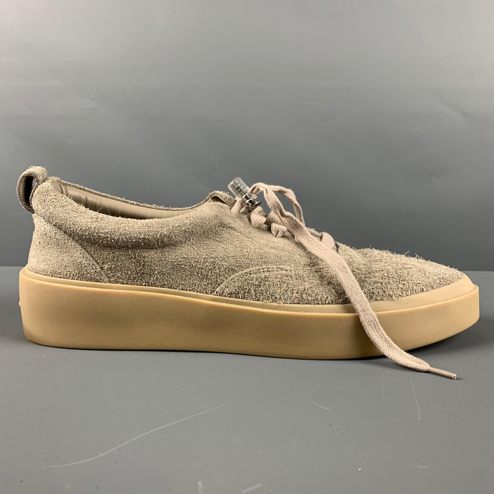 FEAR OF GOD sneakers comes in a grey textured suede featuring a rubber sole and a lace up closure. Made in Italy. Very Good Pre-Owned Condition. 

Marked:   44Outsole: 12.25 inches  x 4 inches  
  
  
 
Sui Generis Reference: 129550
Category: