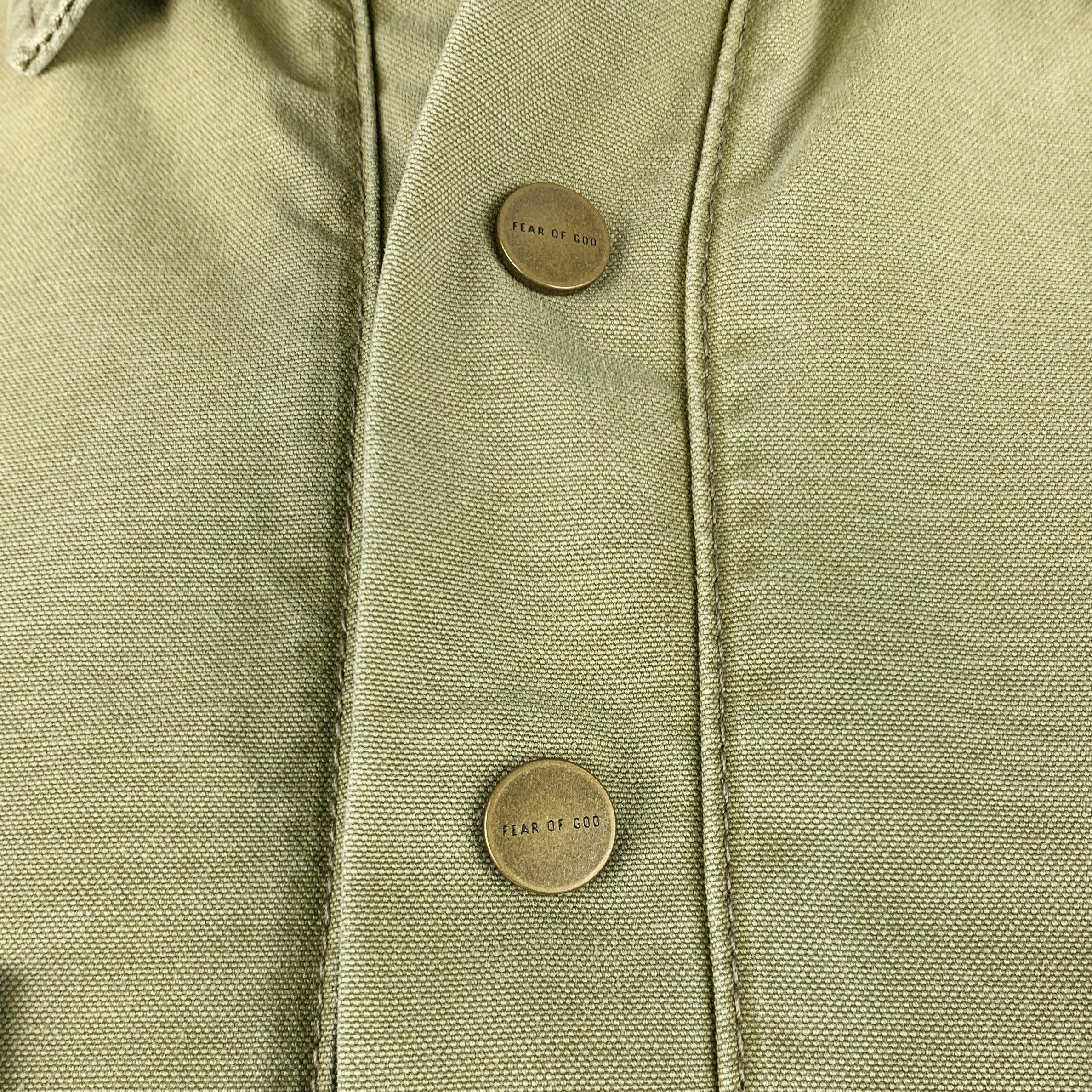 FEAR OF GOD jacket
in a
khaki cotton fabric featuring two large pockets, spread collar, and half placket snap closure. Made in USA.Very Good Pre-Owned Condition. Moderate marks. 

Marked:   L 

Measurements: 
 
Shoulder: 22 inches Chest: 56 inches