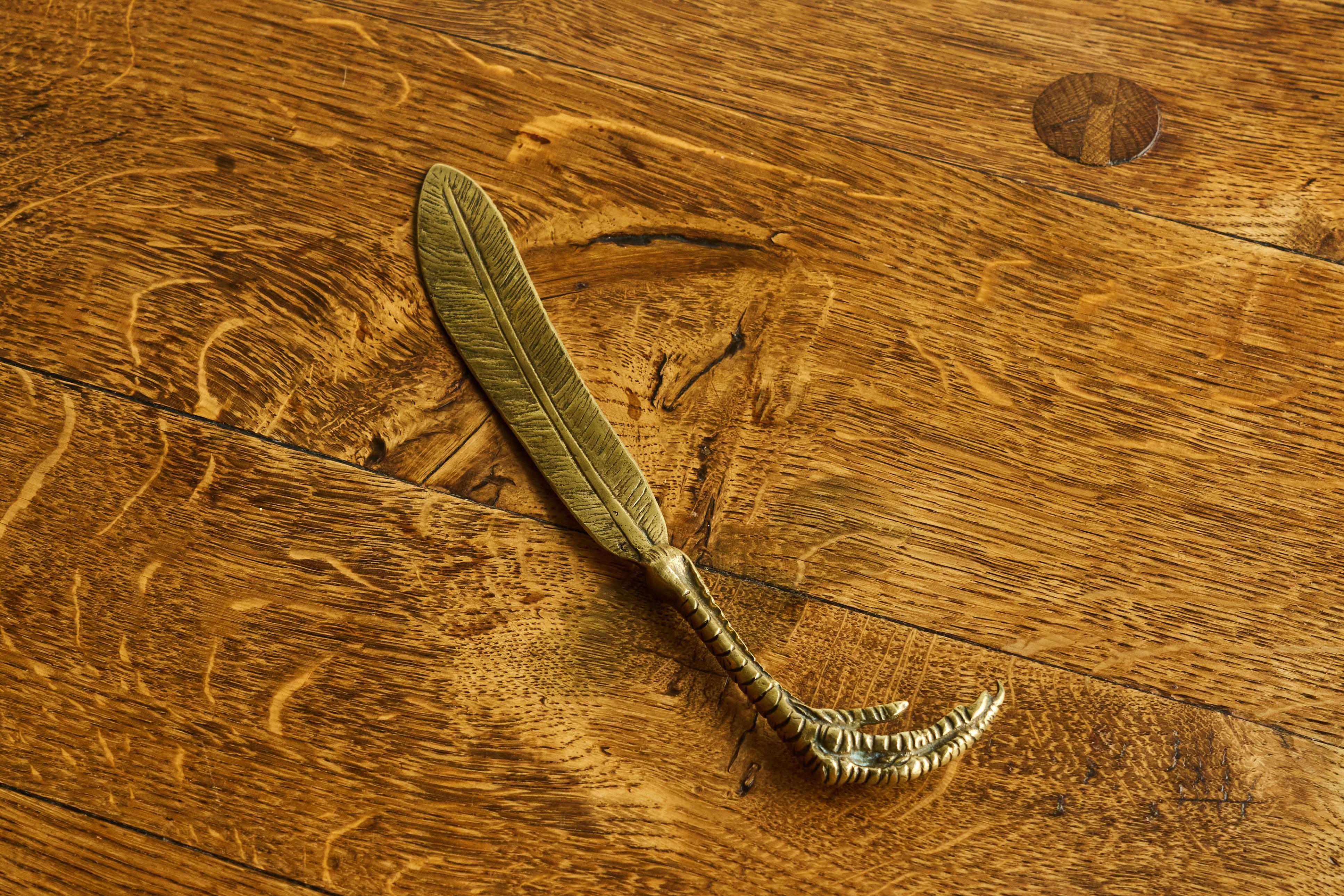 Feather and Claw Shaped Letter Opener in Patinated Sand Cast Brass, Europe, 1960s.

Very stylish and unusual - this feather and claw shaped letter opener in sand cast brass. Great appearance and execution, a high end piece. Great patina. Looks