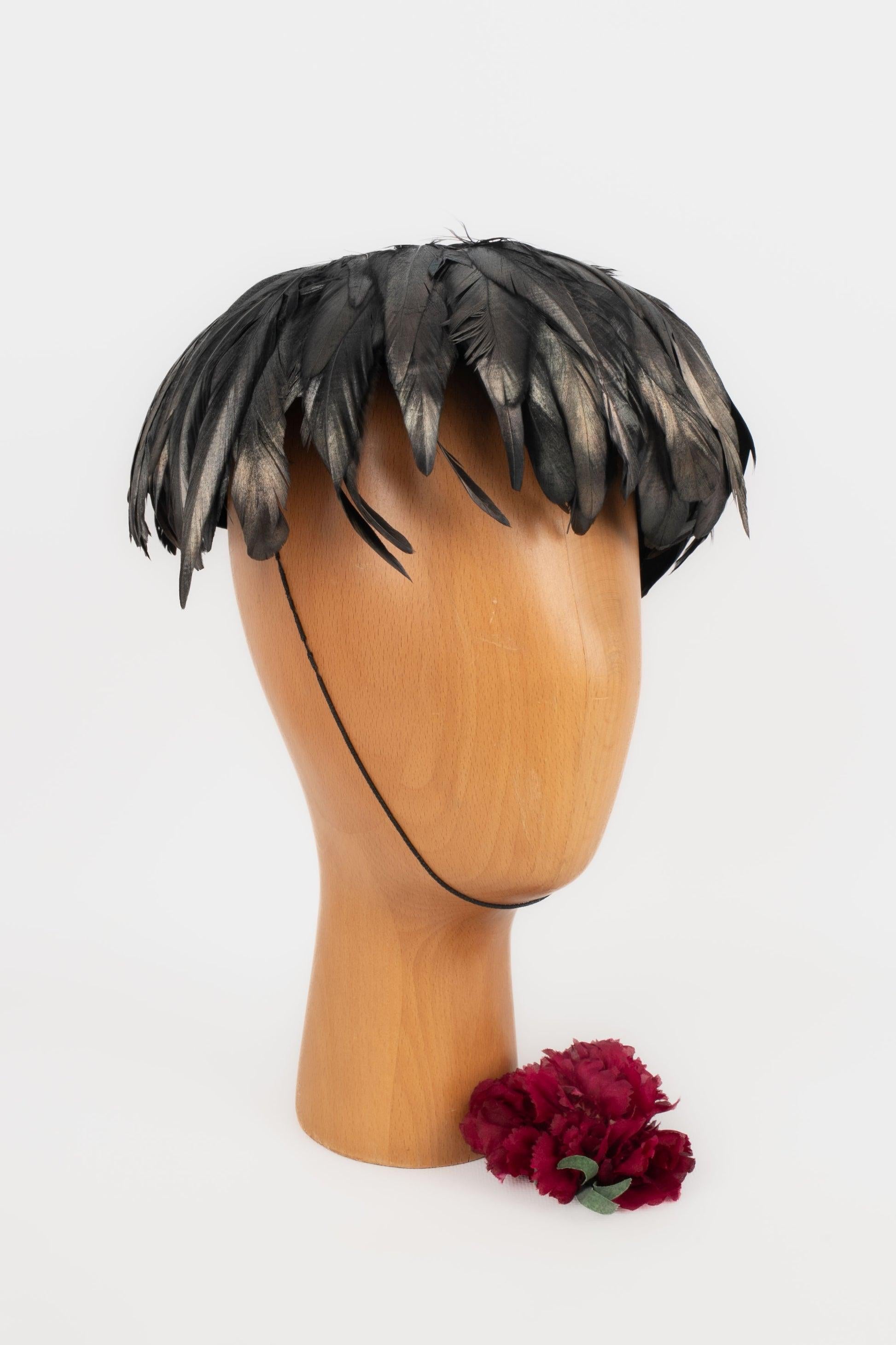Unknown - Black velvet hat ornamented with rooster feathers.

Additional information:
Condition: Very good condition
Dimensions: Single-size

Seller Reference: CHP128