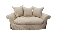 Feather-Filled Damask Loveseat with Rolled Arms and Pleated Skirt