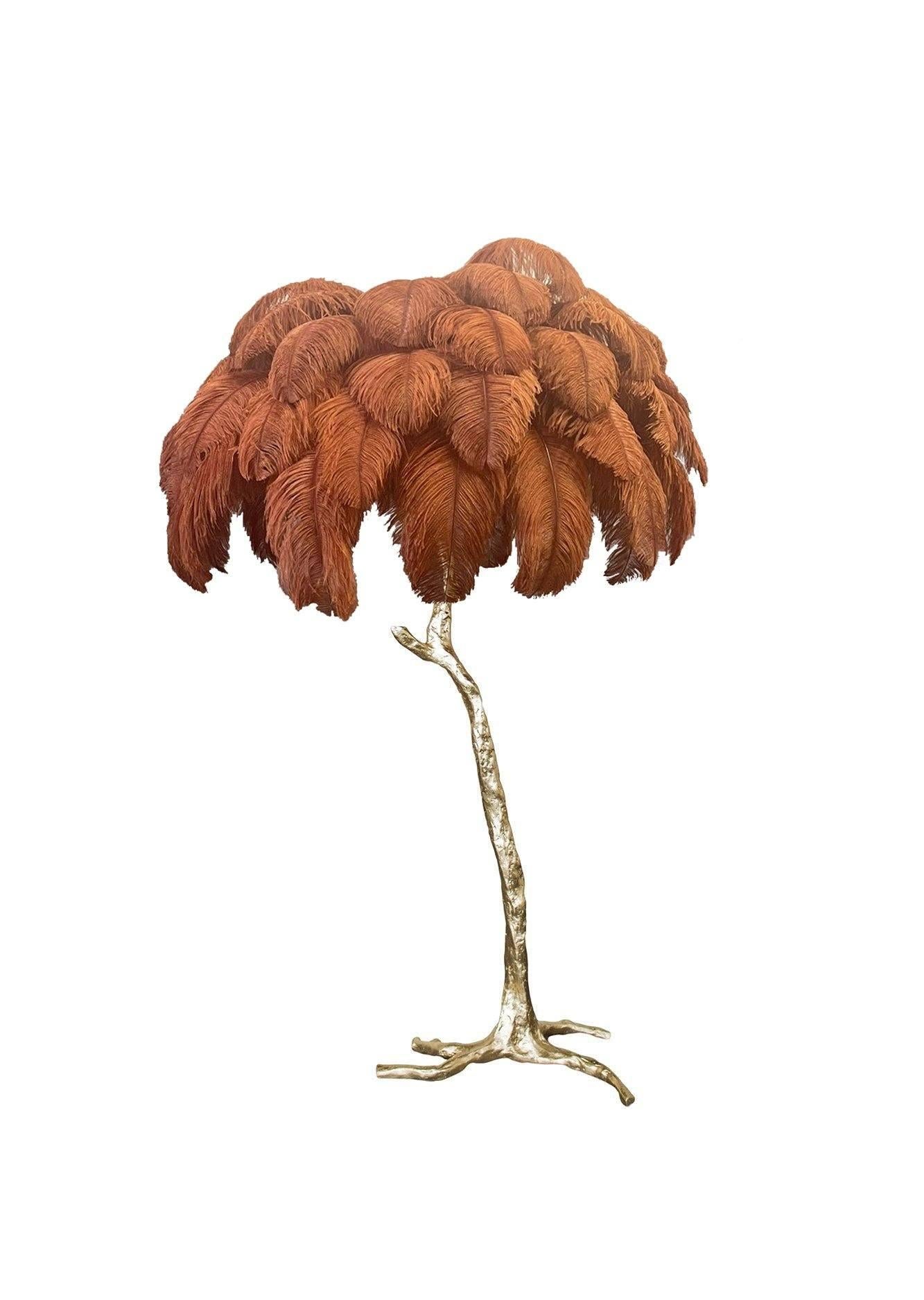 The Feather Floor Lamp, edition piece by A Modern Grand Tour.
An illuminating palm tree, resplendent with exquisite ostrich feather foliage, the feather floor lamp takes centre stage in any luxury setting and delivers the ultimate midas touch to