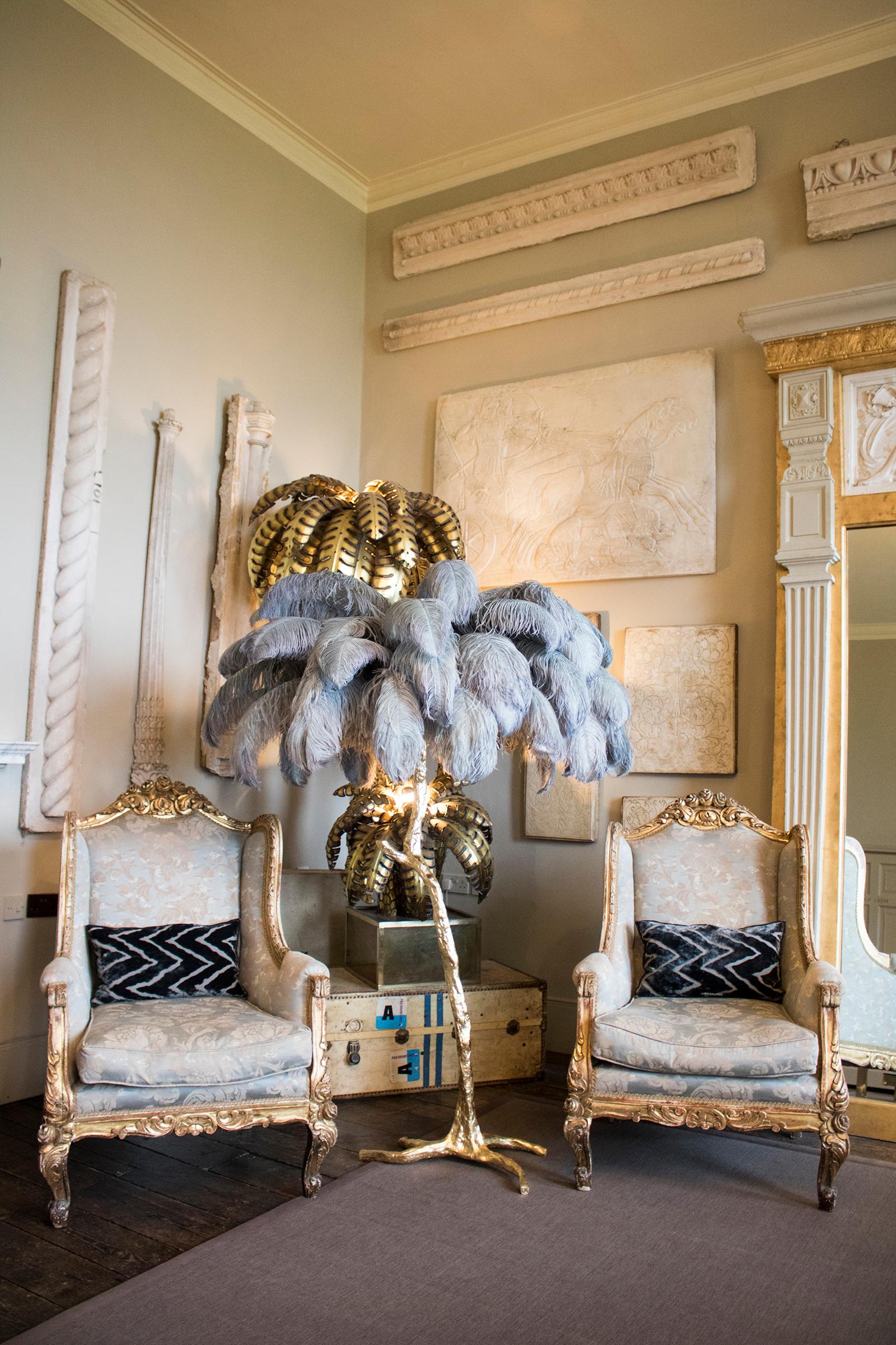 The Feather Floor Lamp, edition piece by A Modern Grand Tour.
An illuminating palm tree, resplendent with exquisite ostrich feather foliage, the feather floor lamp takes centre stage in any luxury setting and delivers the ultimate midas touch to