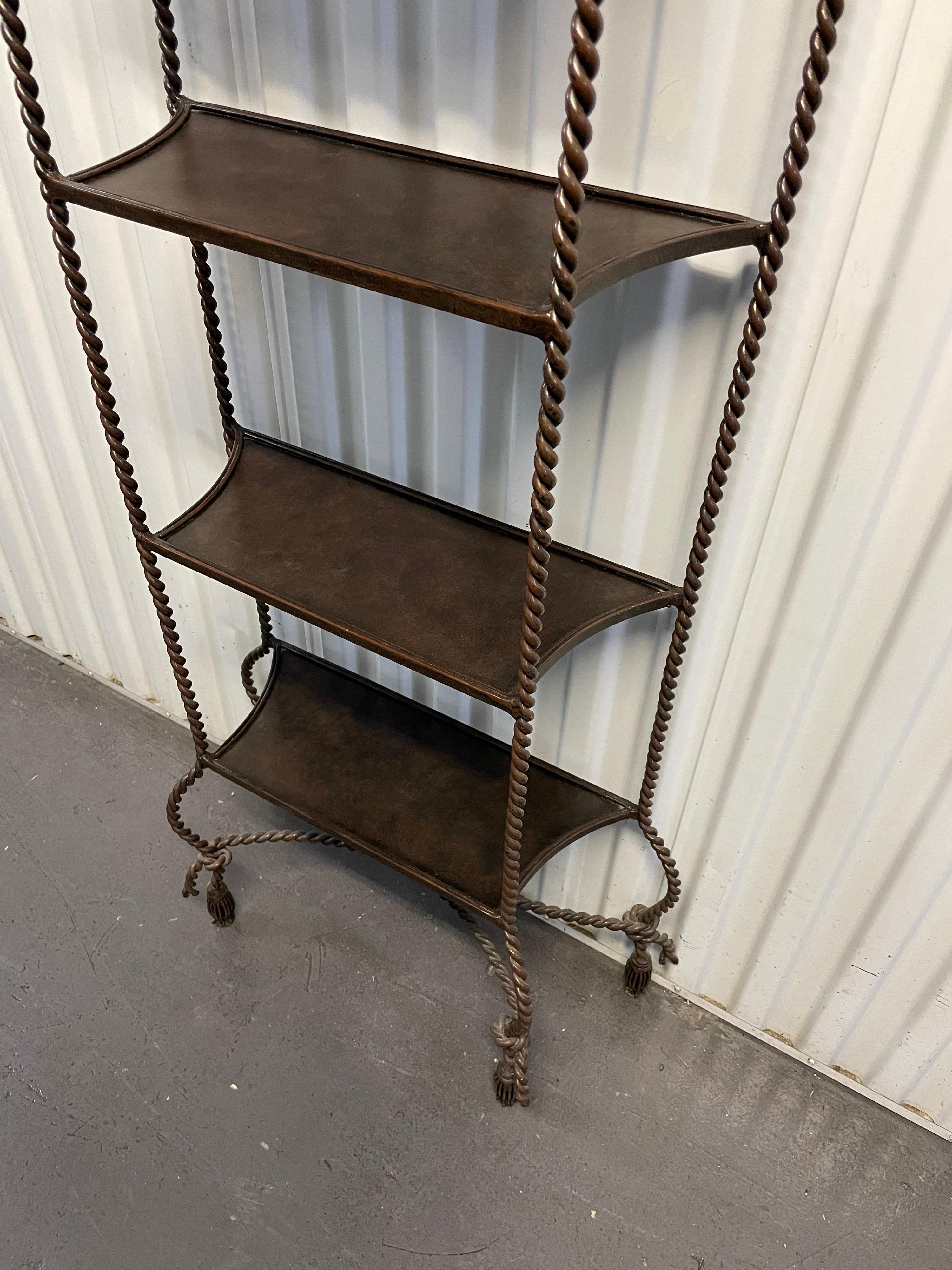 Rope & Tassel feather topped five shelf etagere in a bronze finished iron.