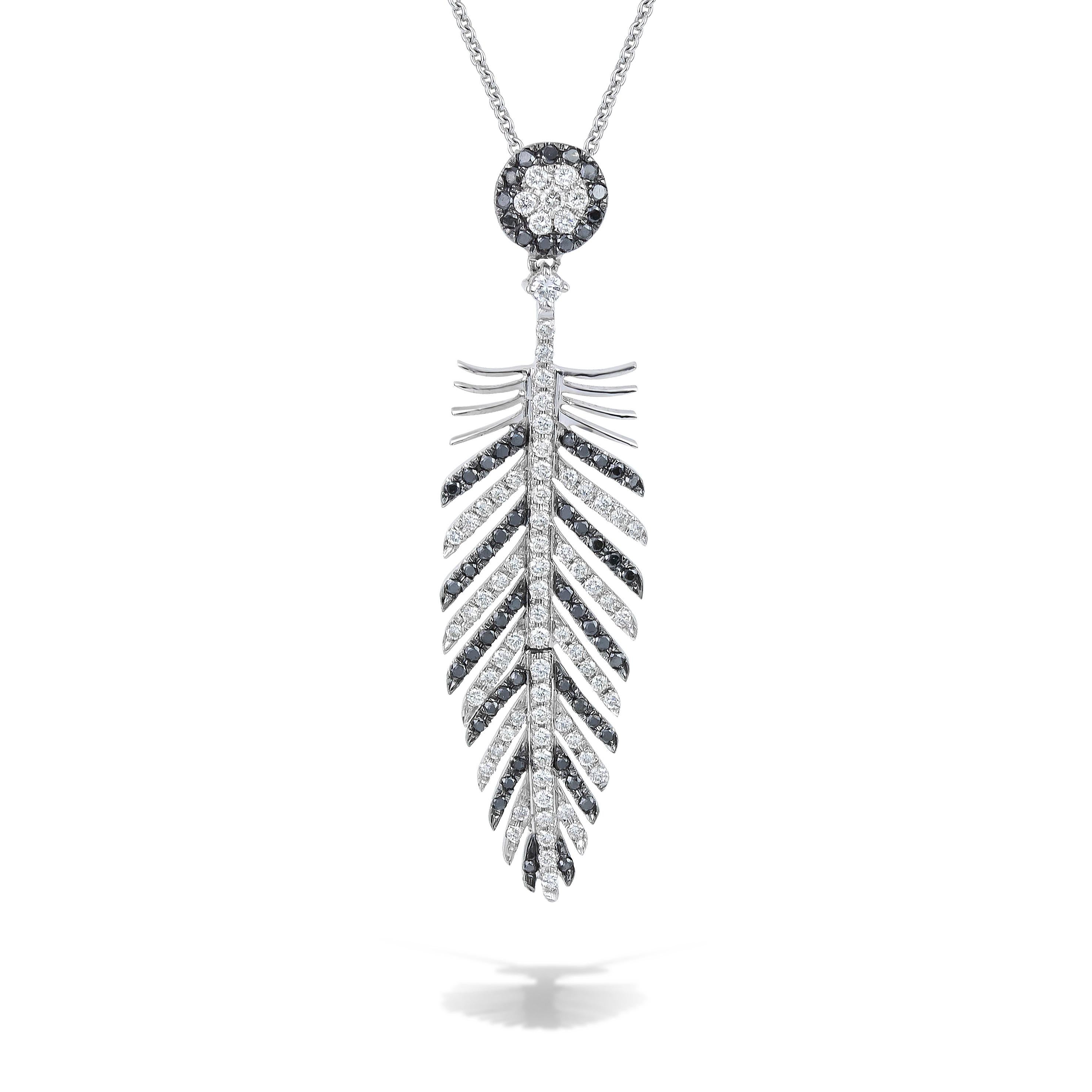 Unique Feather wing pendant necklace with black and white brilliant cut diamonds, handcrafted in 18Kt white gold. 
The white diamonds contrast sharply with the black ones, reflecting and absorbing the light. This One-Of-A-Kind pendant necklace