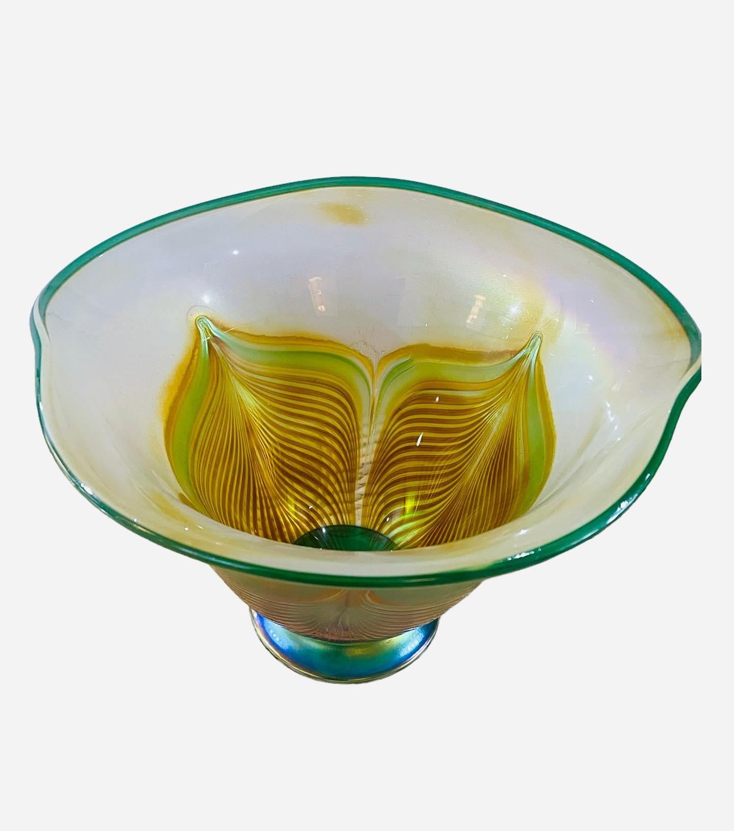 Presenting this large, Igor Muller art glass vase. Signed Vase is decorated with a greens, soft purple and yellow golds iridescent body featuring iridescent peacock blue, beautiful feathered design in art glass. Truly a stunning peice.