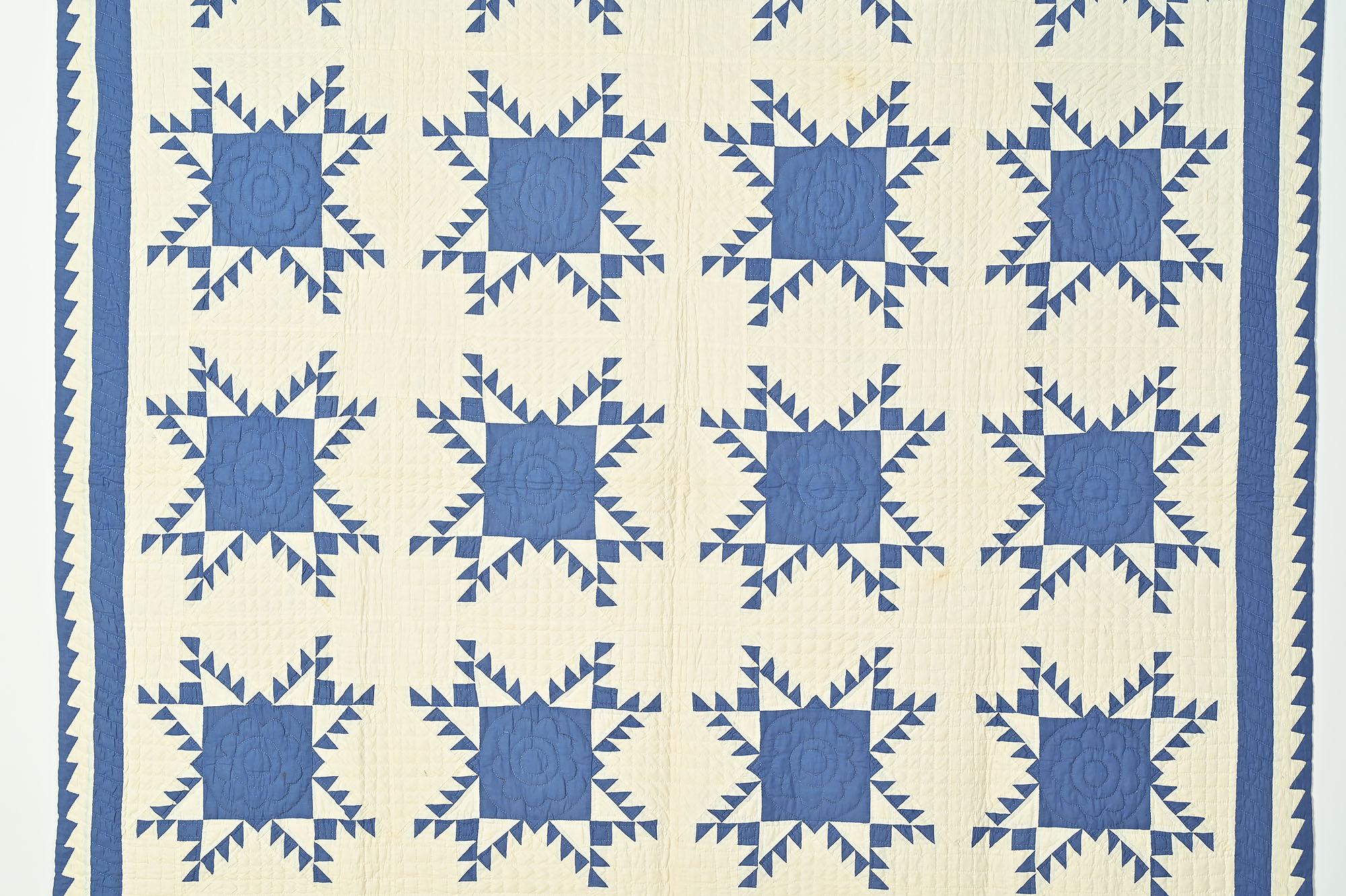 This Feathered Stars quilt is as crisp and fresh as the day it was made some 100 years ago. Clearly, it has not seen the light of day. The white parts of the quilt are stitched with one inch squares. The blue centers of the stars are done with