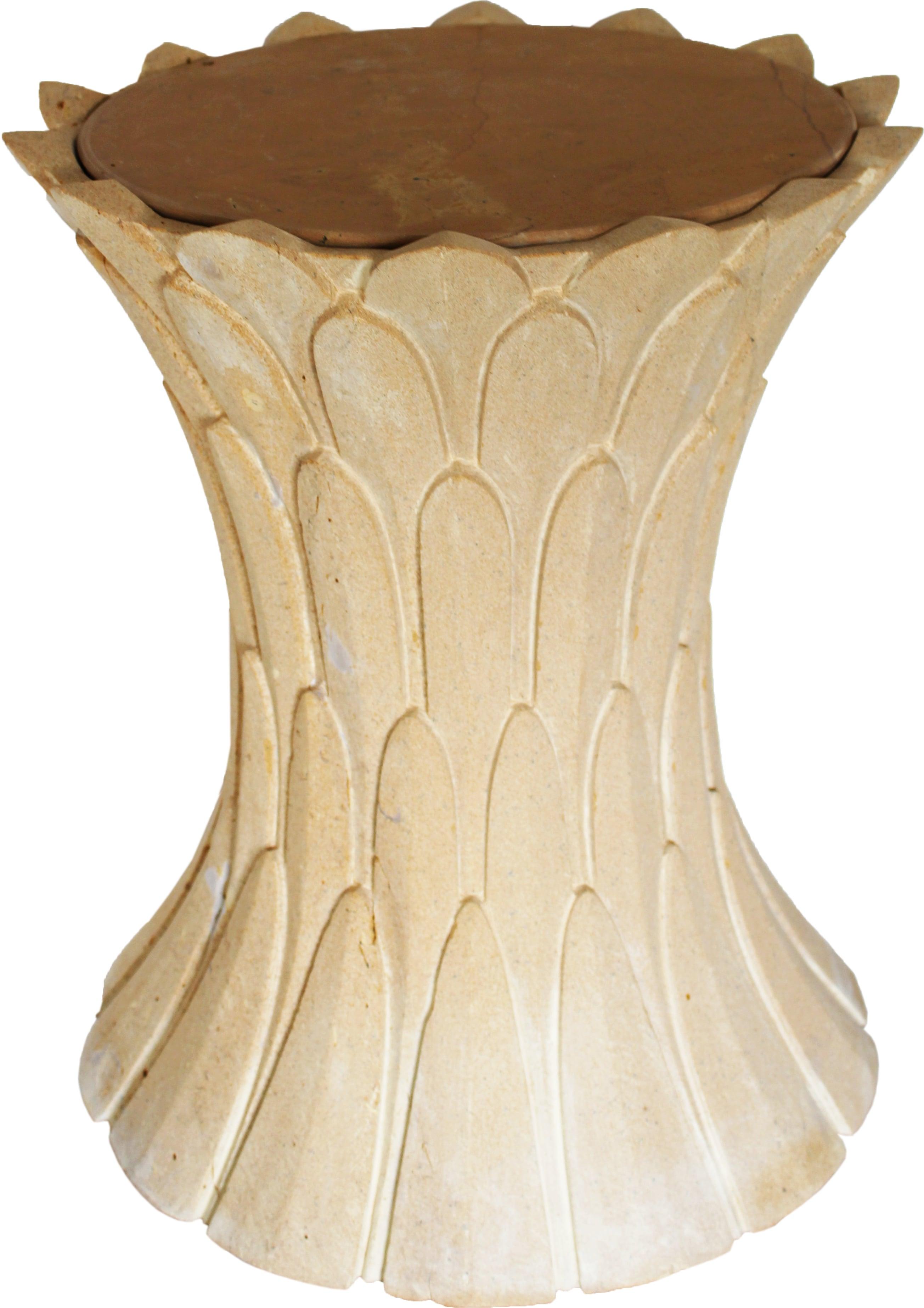 Inspired by the temple carvings in and around Udaipur, Stephanie Odegard designed this unique side table using locally available stones. The arrangement of the carved leaf motif is toned down to give a much lighter feel and appearance. 
 
Feathers