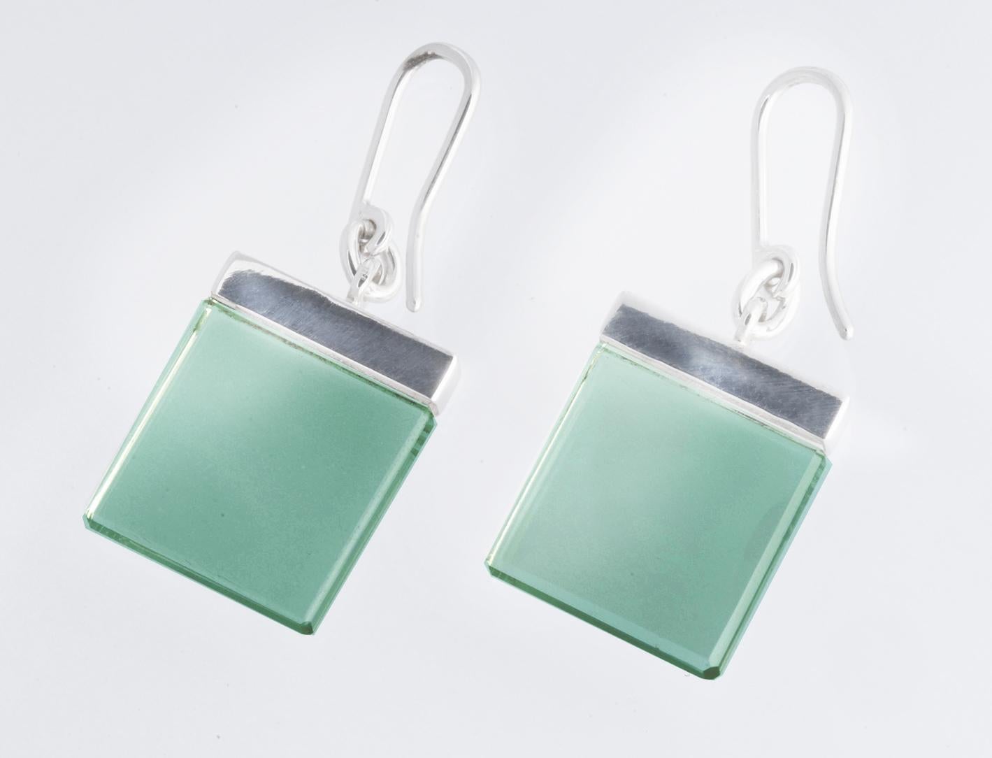 The earrings are made of 18 karat white gold and feature 15x15x3 mm natural green quartzes that are both attractive and elegant.

This contemporary jewellery collection was originally designed by artist Polya Medvedeva as sculptures made of cubes of