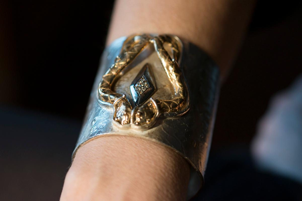 Rossella Ugolini Design Collection  a Fierce Sensual Cuff Snakes Bracelet Handcrafted in 24 Karat Gold Plated Silver Sterling and 0.20 Karat Brown Diamonds.
On the Modern Silver Sterling bracelet two 24 Karats gold plated bronzed snakes meet and by