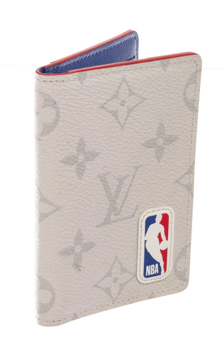 Featuring a white Monogram coated canvas leather with NBA patch and a blue
