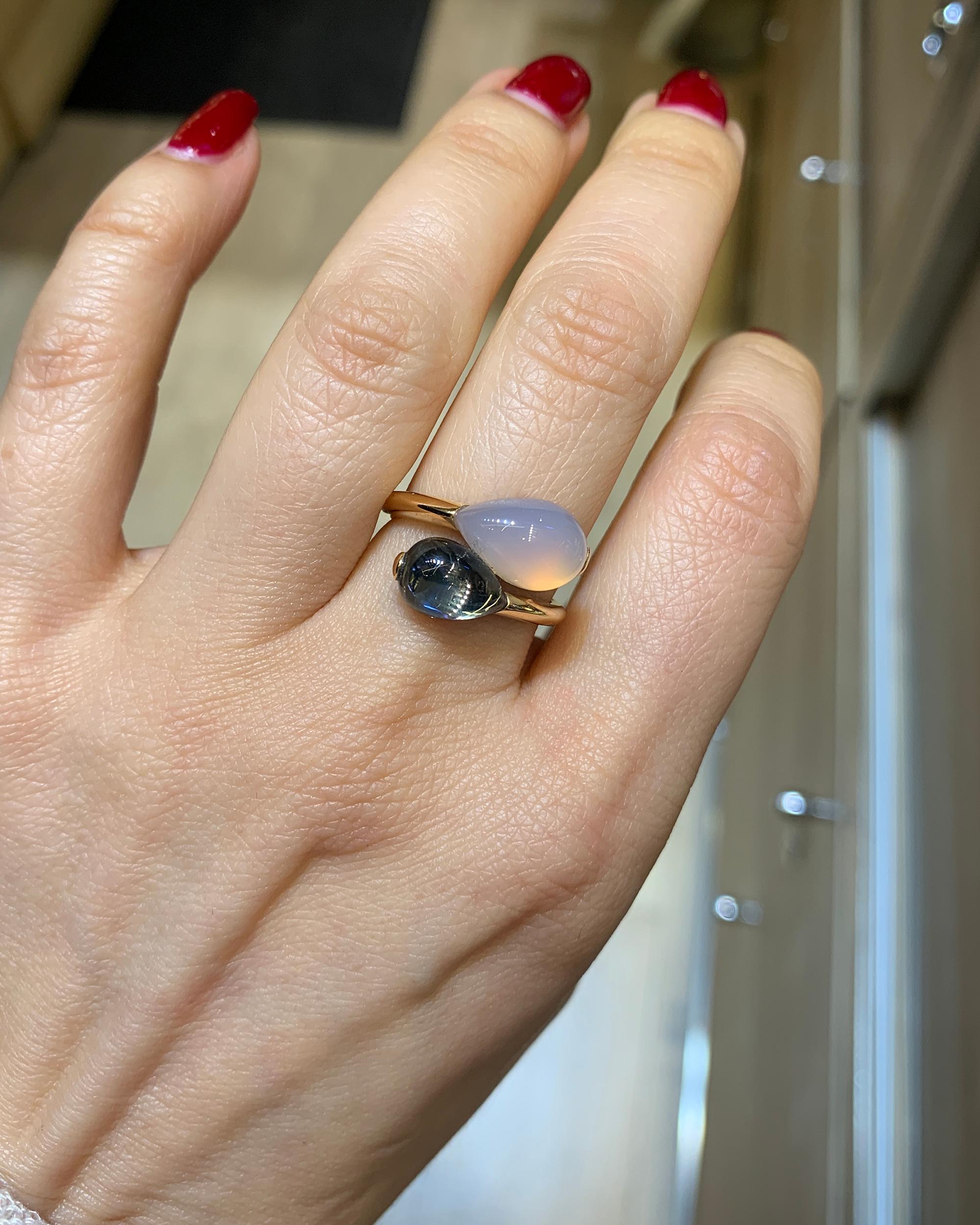 A stylish ring for everyday wear. 
It's made in Italy by Fecarotta jewelers.
It is designed as a twin ring featuring a 2.87 carat cabochon blue topaz and 3.98 carat cabochon quartz.
The metal is 18K rose gold.
Size 6.75