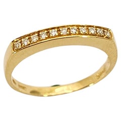 Alianza de oro de 18 Kt y diamantes