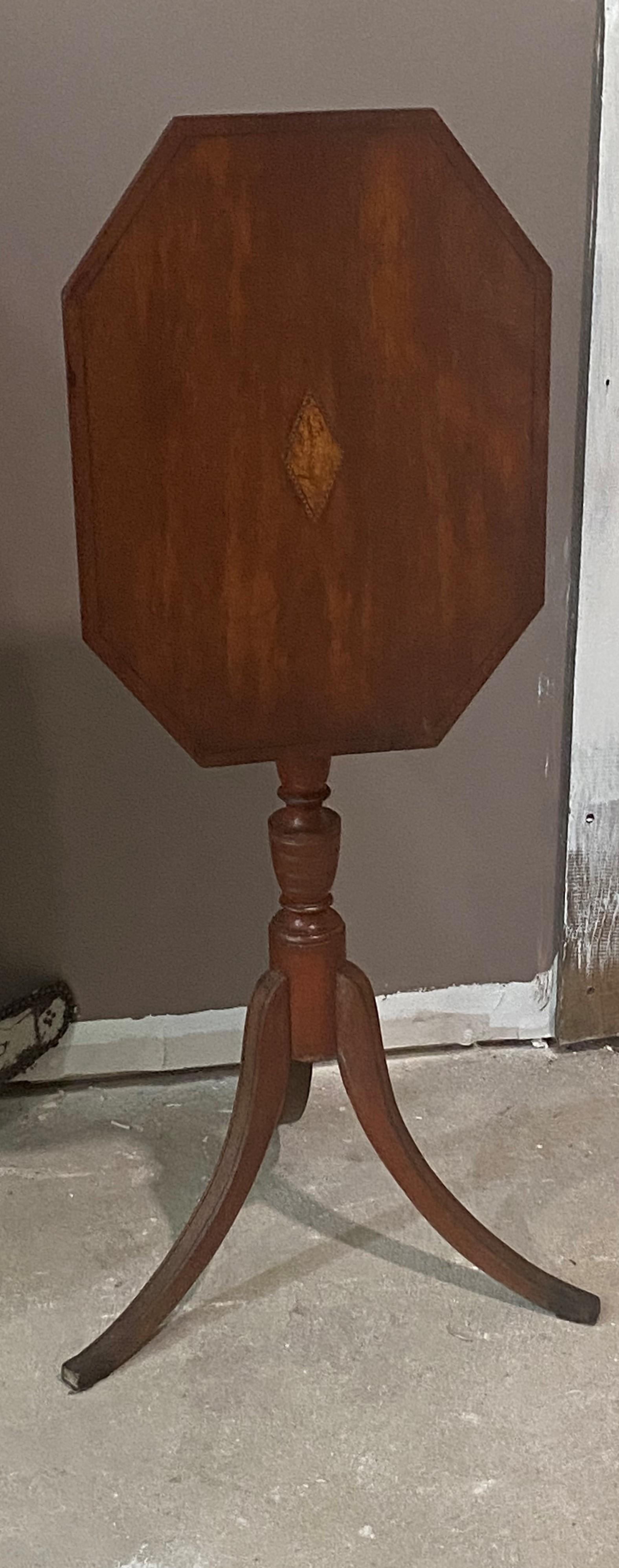Tilt Top Federal candlestand with original turnkey red on the base, bross banded and with inlay on toop. Found in Maiine, New Hampshire or Maine origin with that plain foot. Clean honest table.