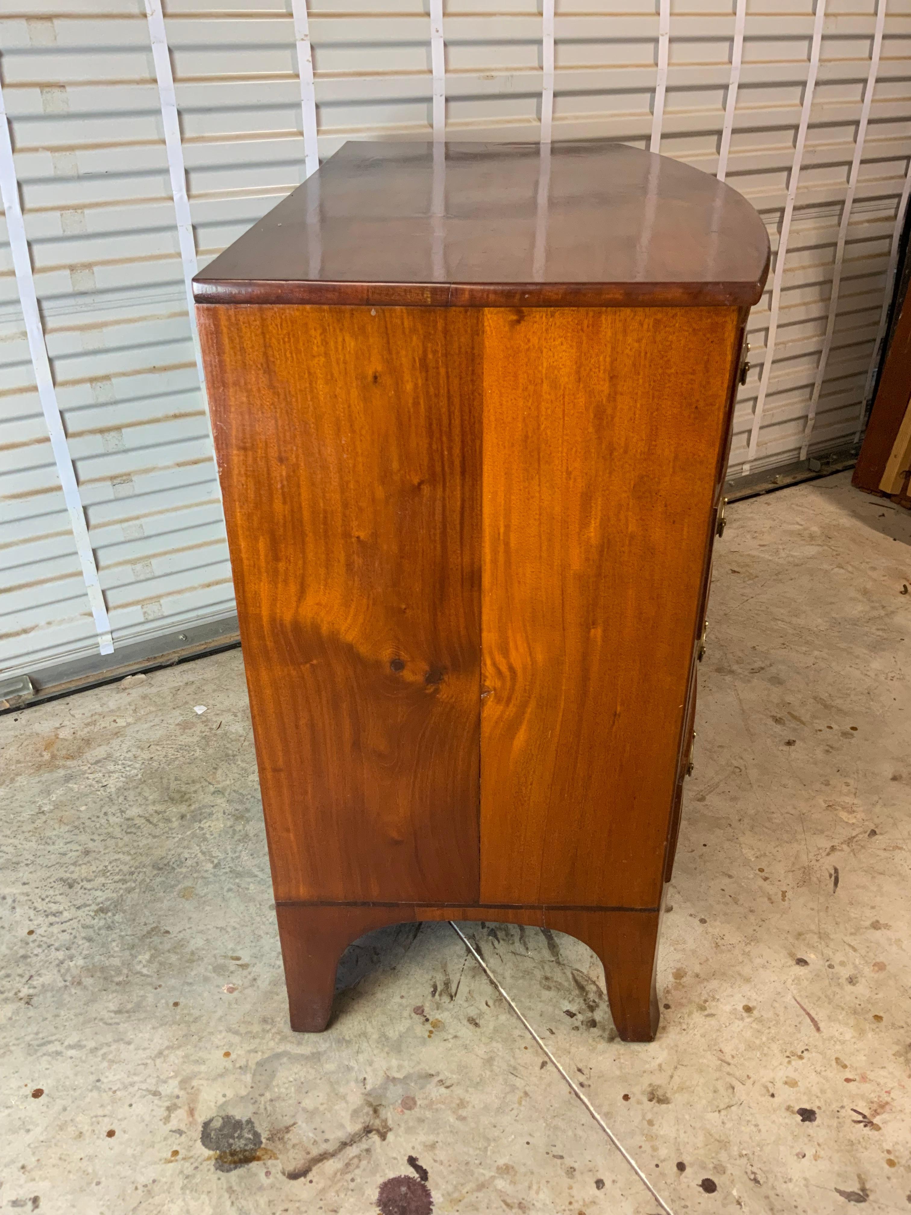 A very nice and clean Federal Mahogany Hepplewhite chest with cock beaded drawers and resting on a tall French foot.  Very good condition older refinish with a great color and patina to the aged Mahogany.  Older pulls in the original hardware holes.
