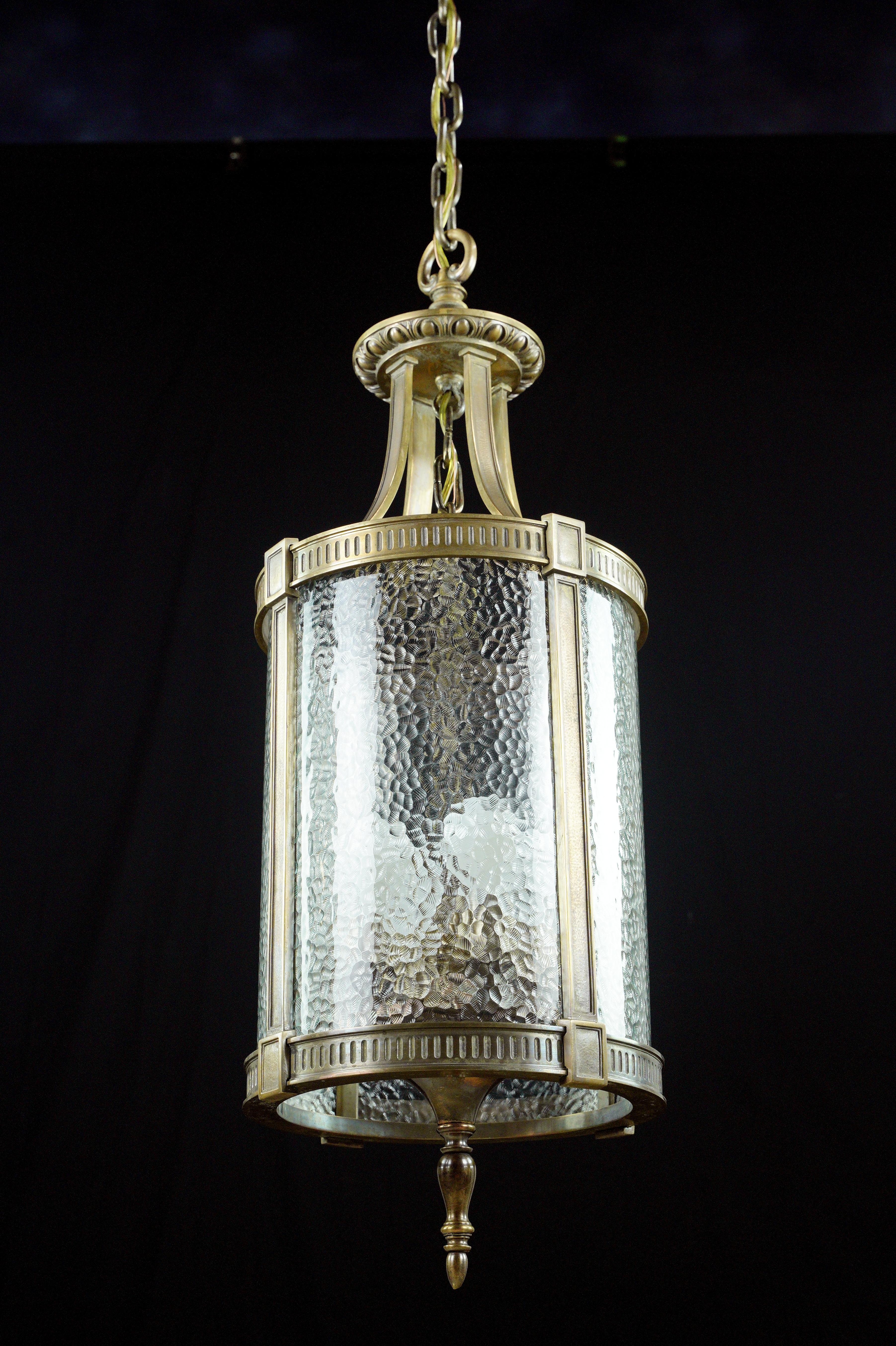 American Federal Bronze Clear Pebbled Glass Lantern Pendant For Sale