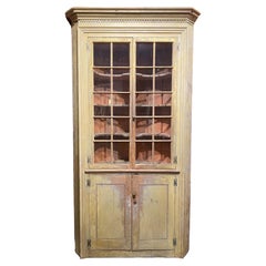 Antique Federal Corner Cupboard in Early Yellow Paint with Glazed Doors & Barrel Back