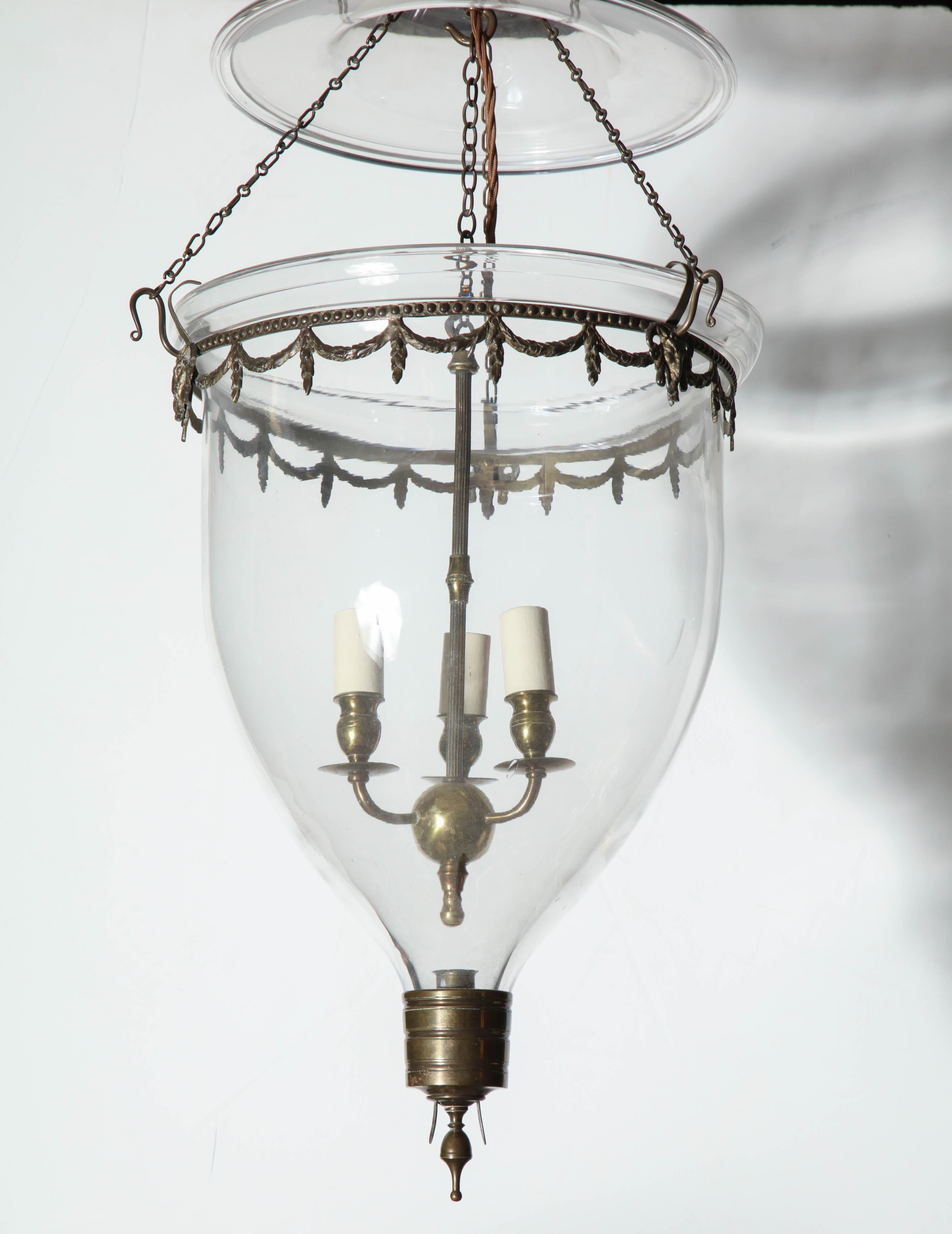 Federal glass bell jar hall lantern with brass drapery band and base with a three-light cluster.