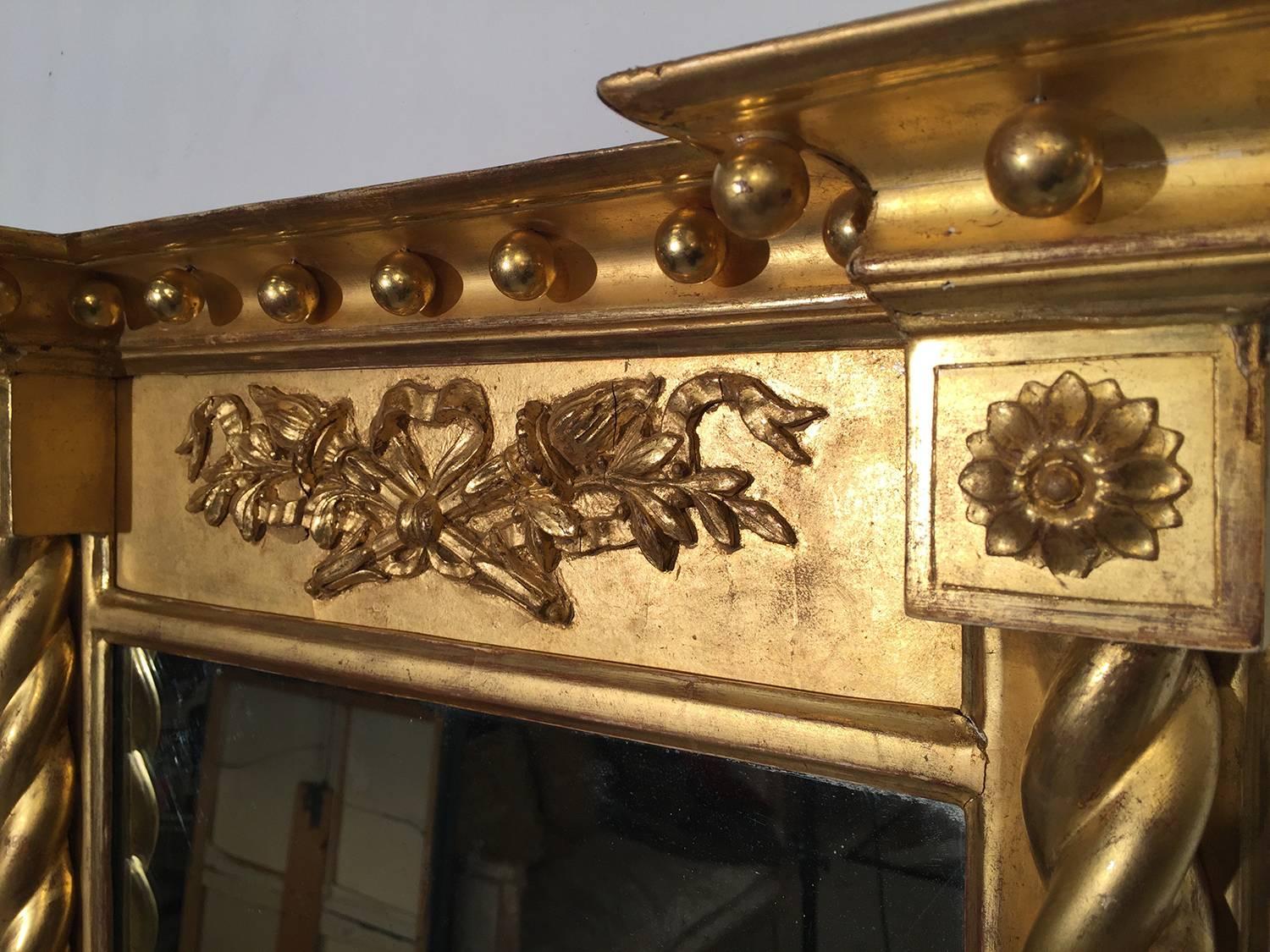 Federal gold gilt mirror with barley twist columns and decorative carving on top, circa 1820-1840. Original wood back.
Dimensions: 22.5 W x 31.5 H.