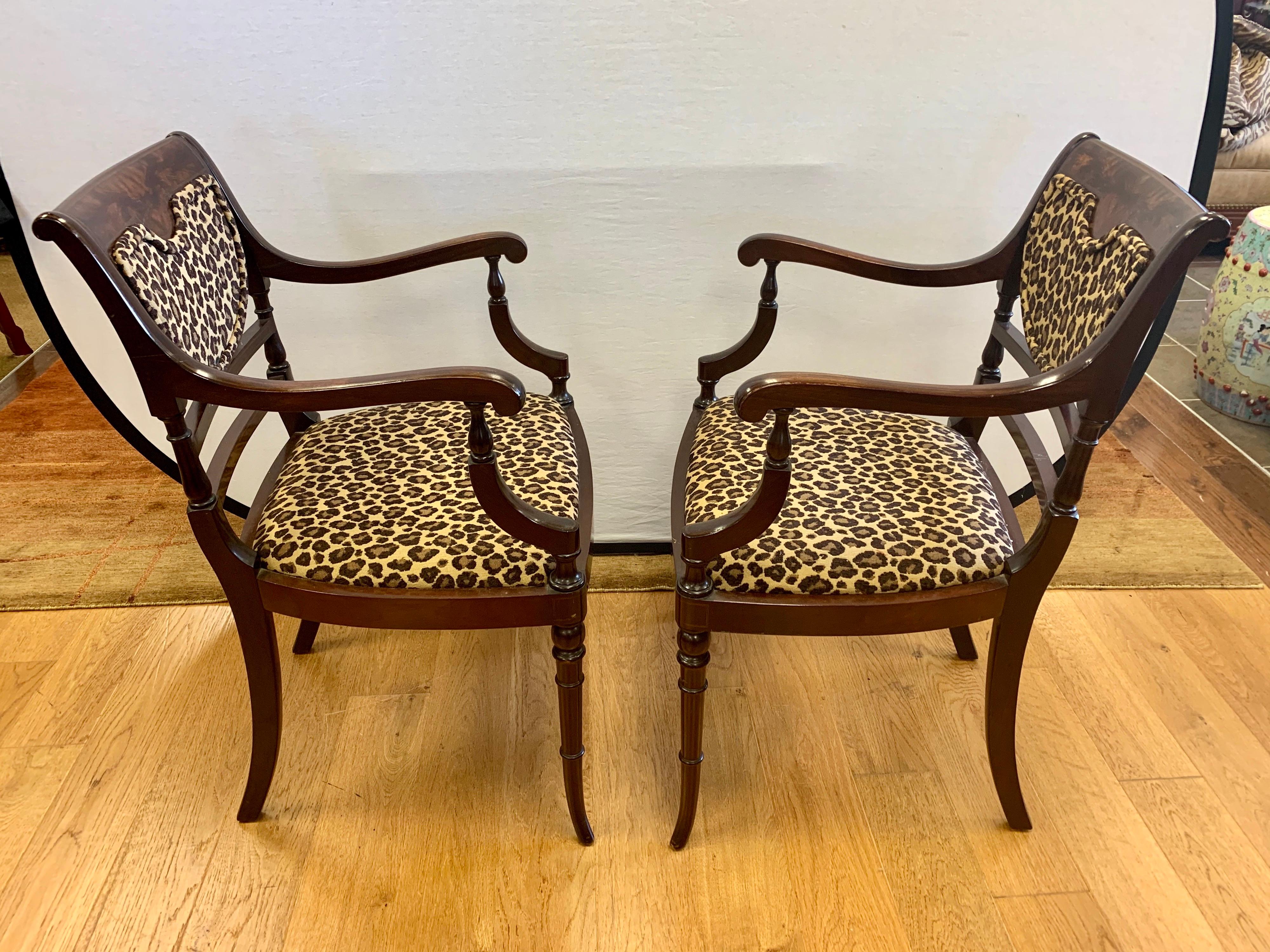 Elegant pair of matching mahogany federal style arm chairs newly upholstered in leopard fabric.
All dimensions are below. Impeccable craftsmanship and scale. Not too big but not too small.
The fabric really pops offset against the rich mahogany