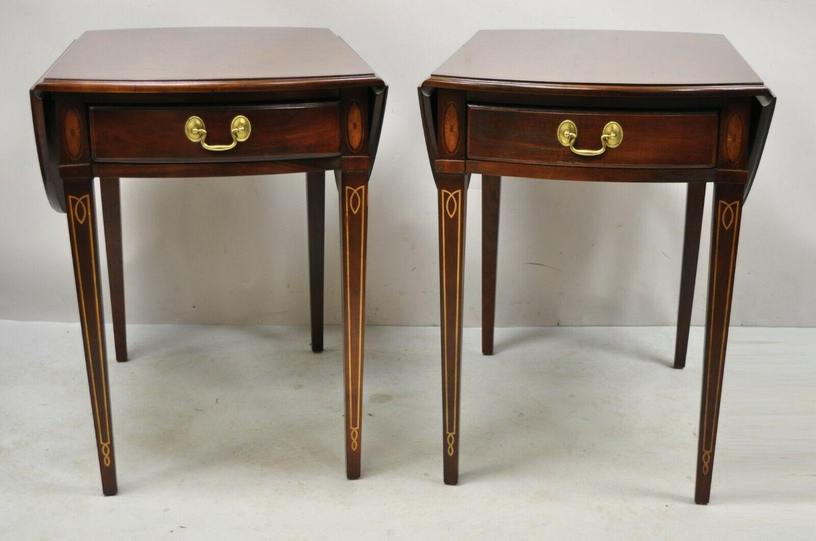 Federal Sheraton Style mahogany pembroke side tables with inlay By Hammary - a pair. Item features a satinwood pin wheel and pencil inlay, drop leaf sides, finished back, 1 dovetailed drawer, tapered legs, solid brass hardware, great style and form.