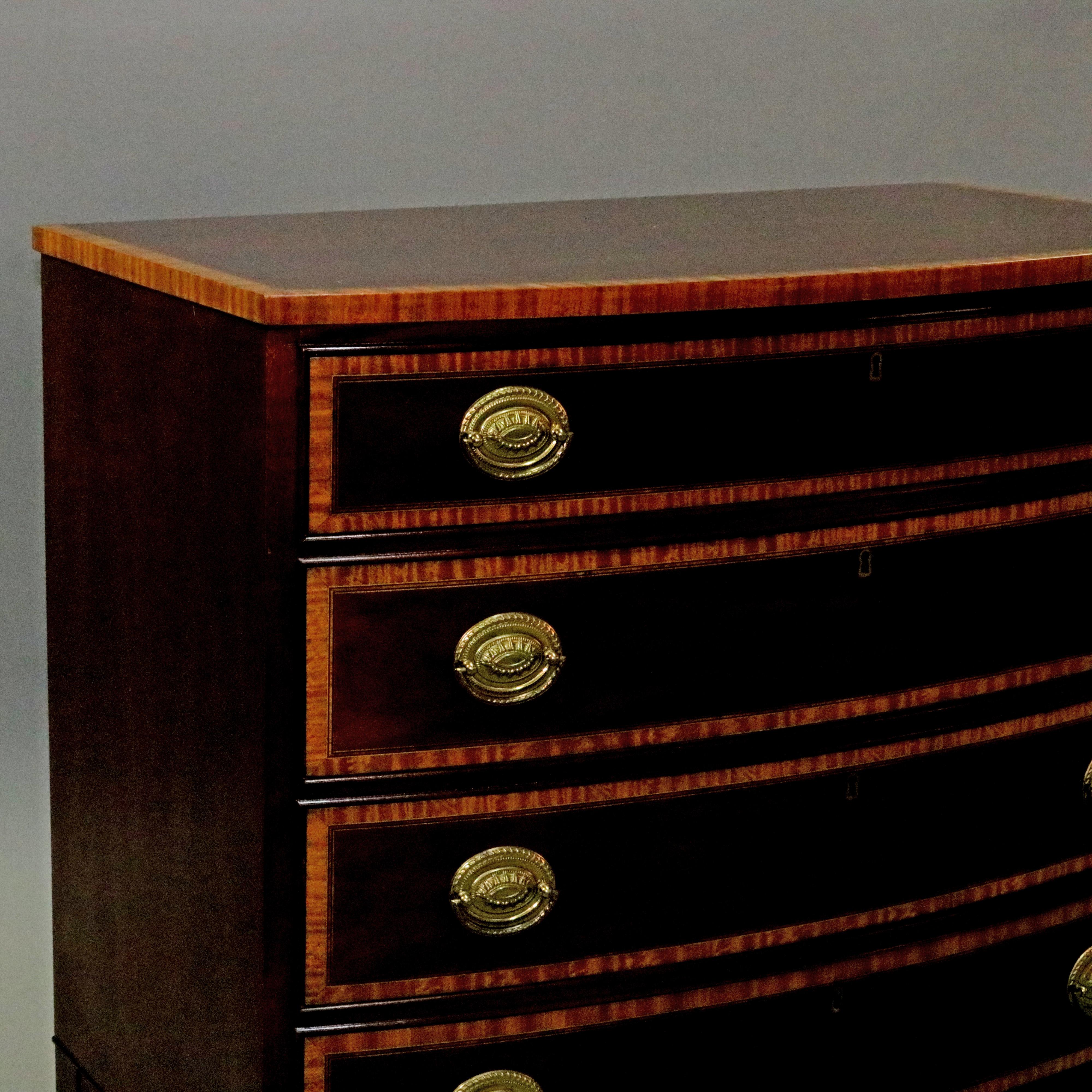 A vintage federal style bachelor's chest offers mahogany construction with cross-banded op surmounting bow front case having four graduated drawers, stainwood banded and brass pulls throughout, maker label as photographed, circa 1940

Measures: