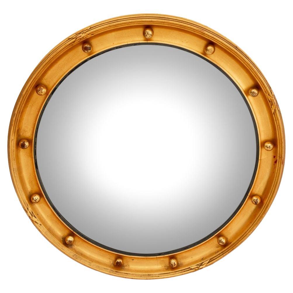 Miroir convexe circulaire en bois doré de style Feder