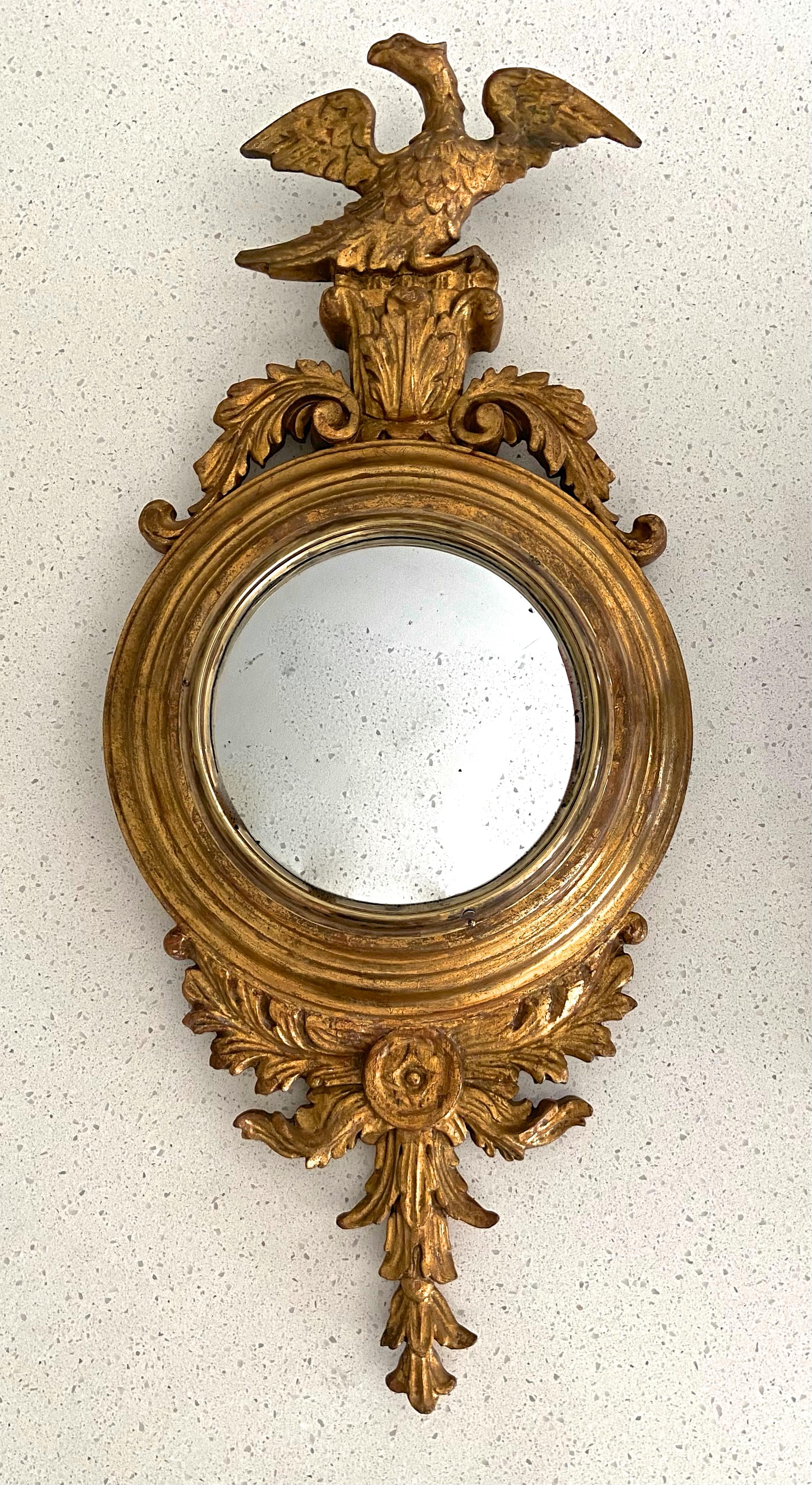 Expertly carved gilt wood Federal style eagle acanthus leaf motif convex wall mirror. Overall sizer 28.5
