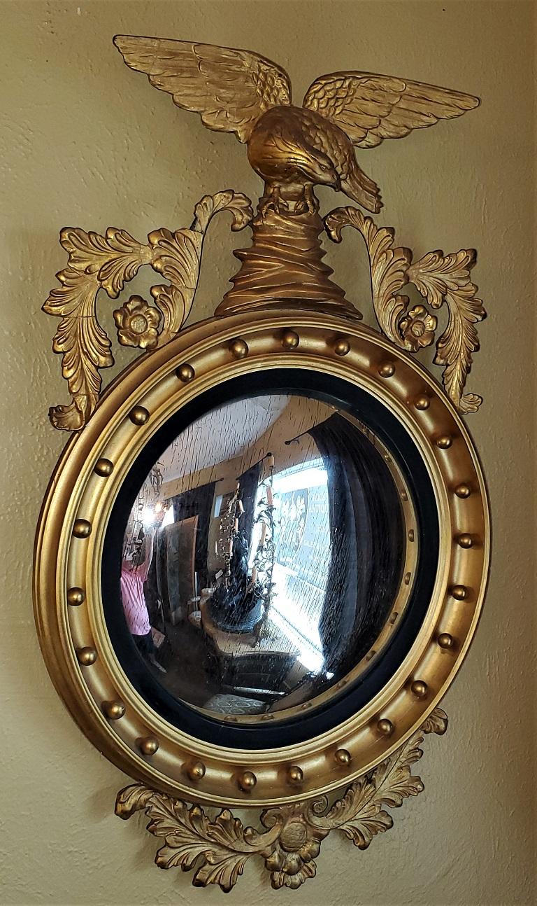 Presenting a gorgeous early 20th century American Federal Style Console Mirror from circa 1920-30.

This console mirror is of the highest quality !

It is constructed of wood and gesso and absolutely gloriously gilded.

On top of the mirror is