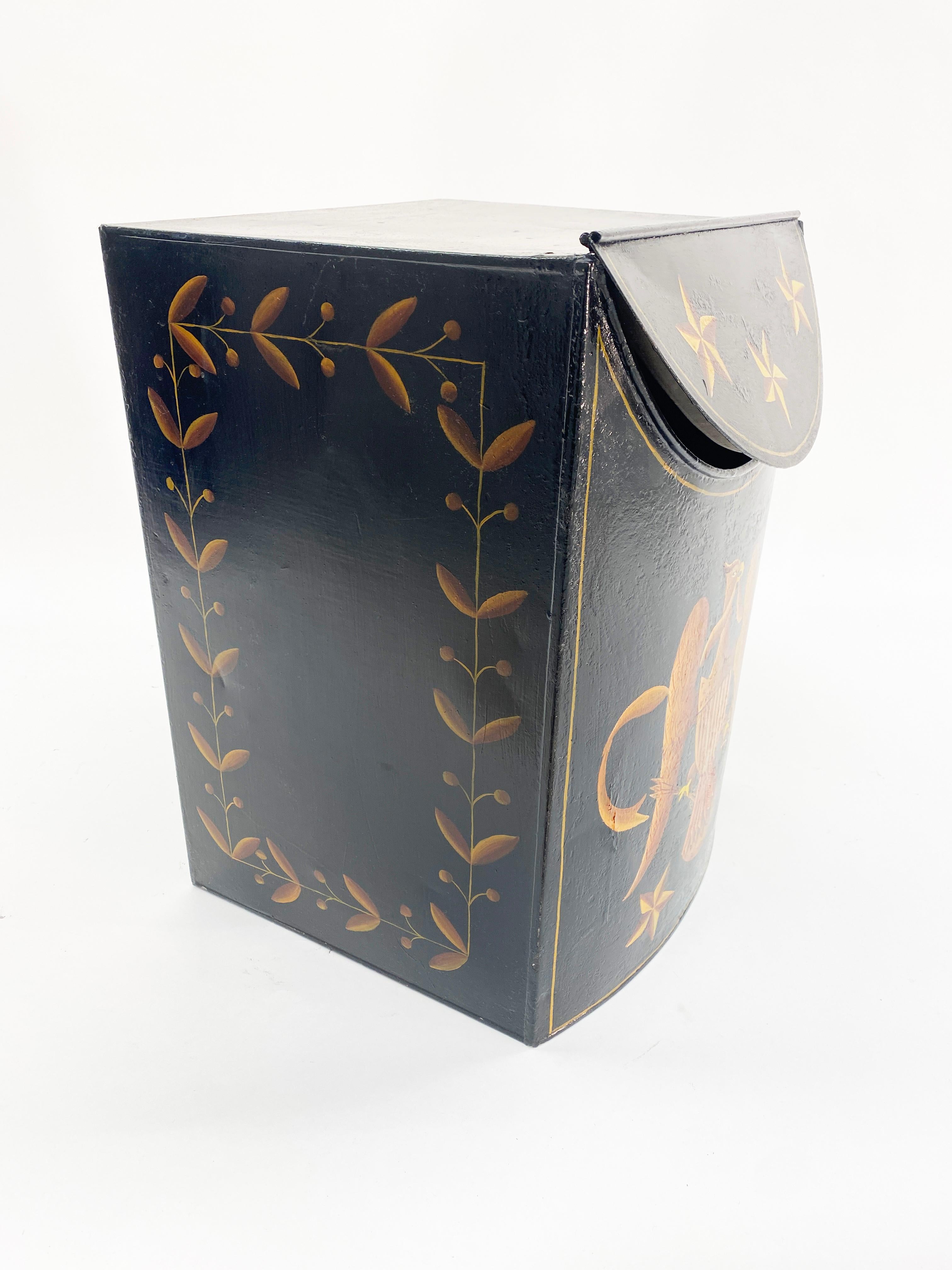 A handsome Federal style hand painted tole tinder wood box. Ebonized lacquer paint overpainted with a federal eagle holding olive branches and arrows and crested with a Union shield. The Eagle is surrounded with nautical stars above and below. The
