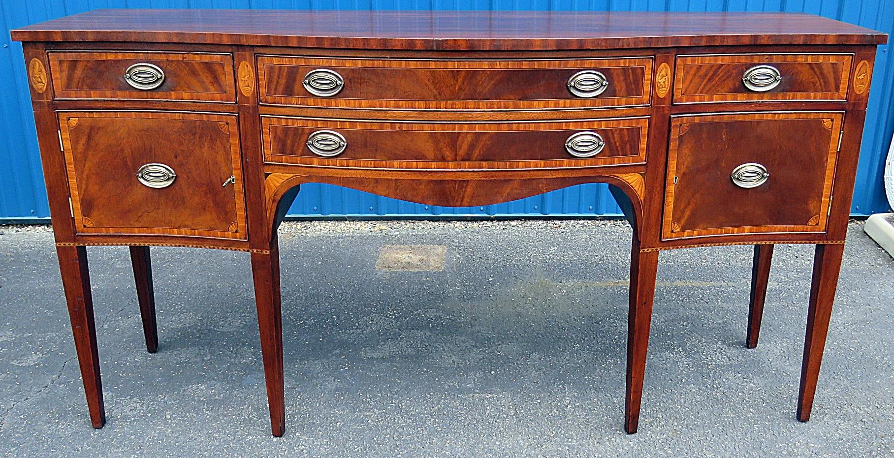 Federal style inlaid sideboard with 4 drawers and 2 doors.