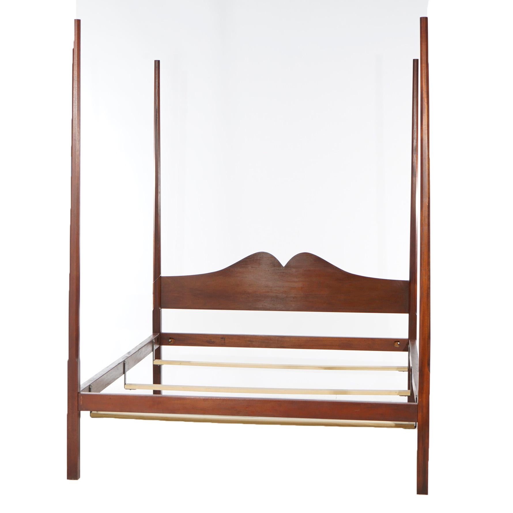 A Federal style pencil post canopy queen size bed frame of The Bartley Collection for the Henry Ford Museum offers mahogany construction with shaped headboard, maker marks as photographed, 20th century

Measures- 83.5'' H x 64.5'' W x 58.25'' D;