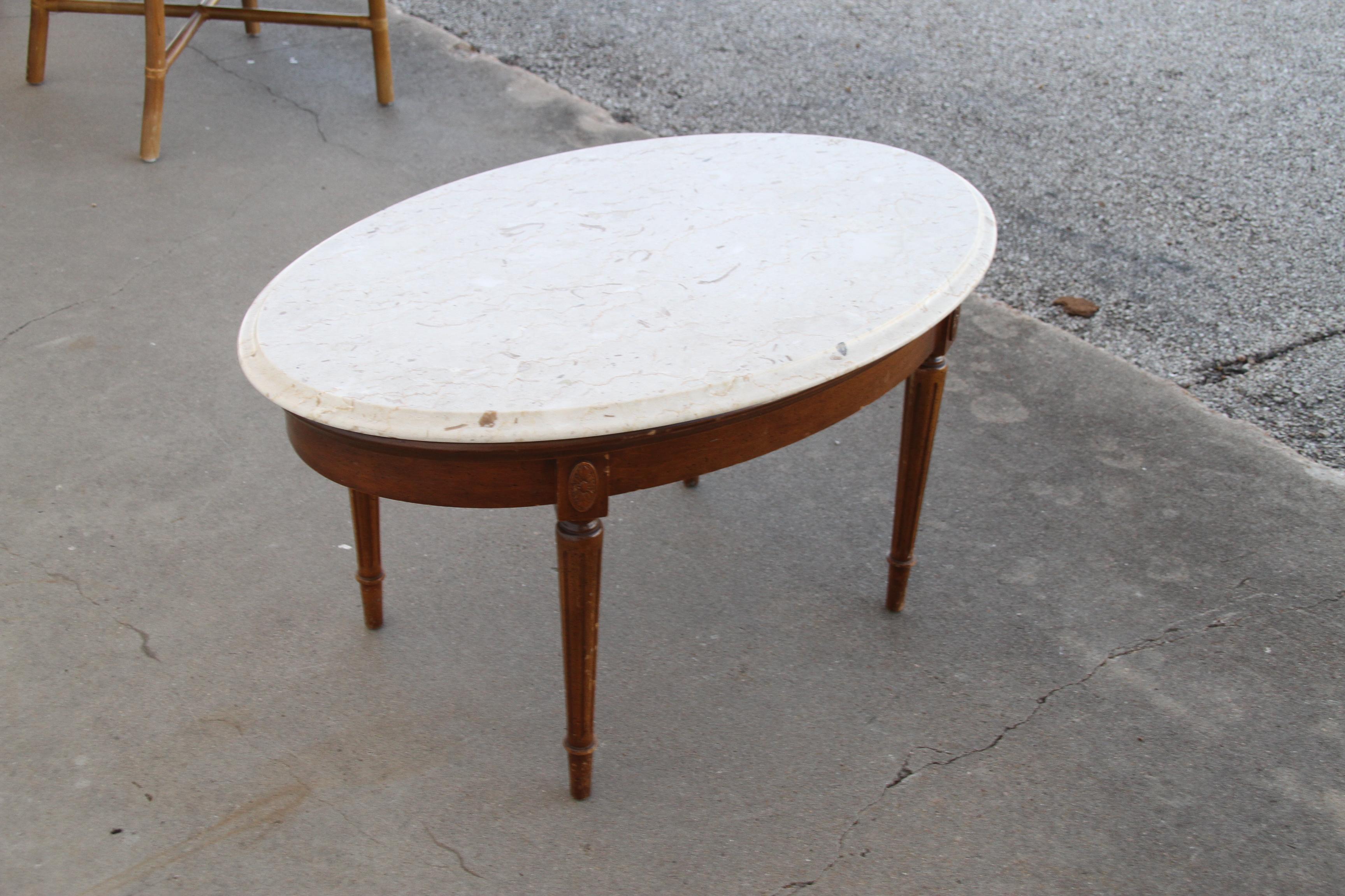 Federal Style marble coffee table.

Oval table in mahogany with white marble top. Carved Federal style legs.

Dimensions: 34