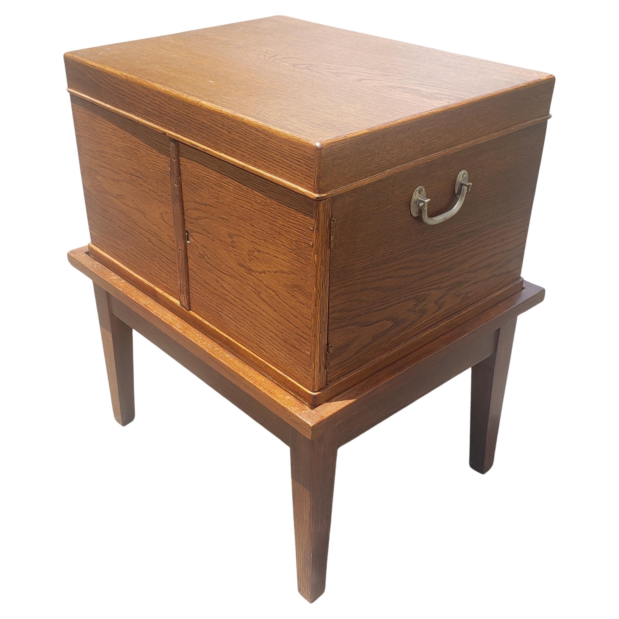 A Edwardian period Federal Style four drawer Oak Silverware Chest on stand, circa 1920s. All drawers are Anti tarnish velvet clothe lined. Some missing silver holder partitions and chip on top left door. Other in good antique antique condition.