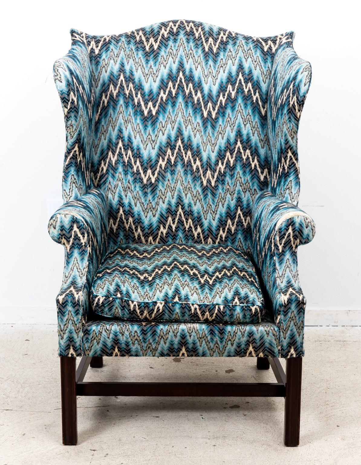 Federal style wing chair in blue flame stitch upholstery. Made in England. Please note wear consistent with age.
 