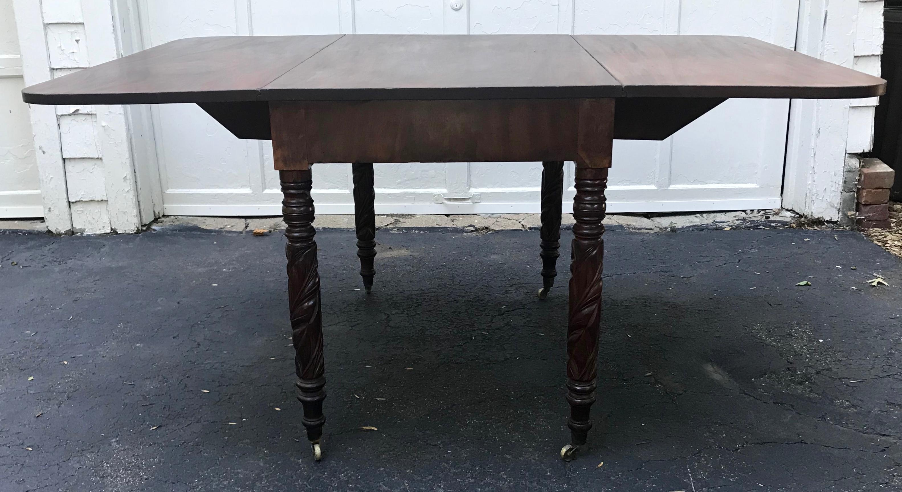 antique metal table with pull out leaves