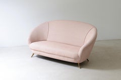 Federico Munari. Elegant two-seater sofa with bronze feet.