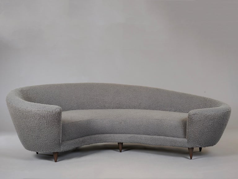 Federico Munari

A very large and comfortable curved sofa by Federico Munari, in a dove grey boucle raised on conical walnut legs. 

Italy, 1960's.