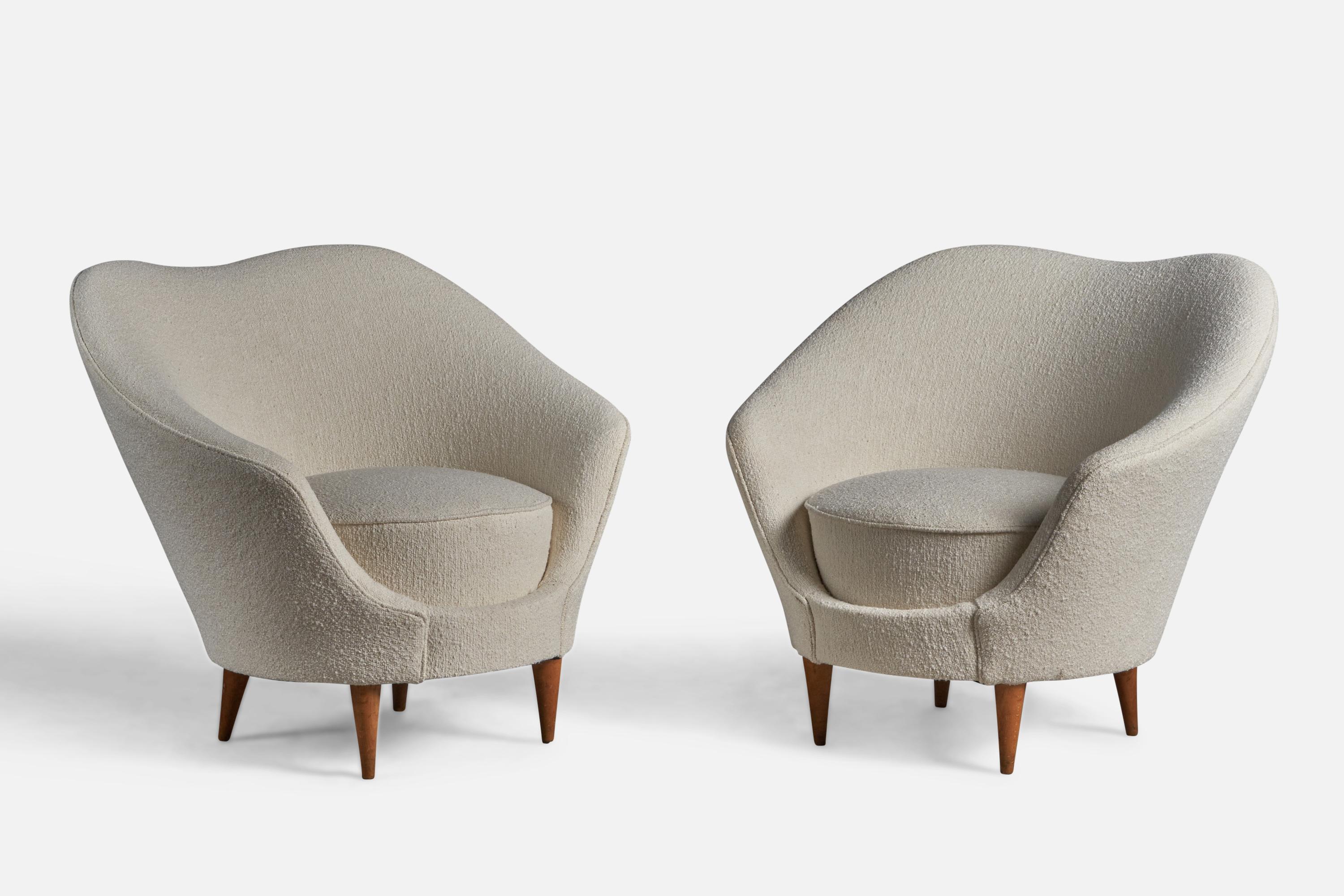 A pair of walnut and white bouclé fabric lounge chairs designed by Federico Munari and produced by ISA Bergamo, Italy, 1950s.

15.5” seat height